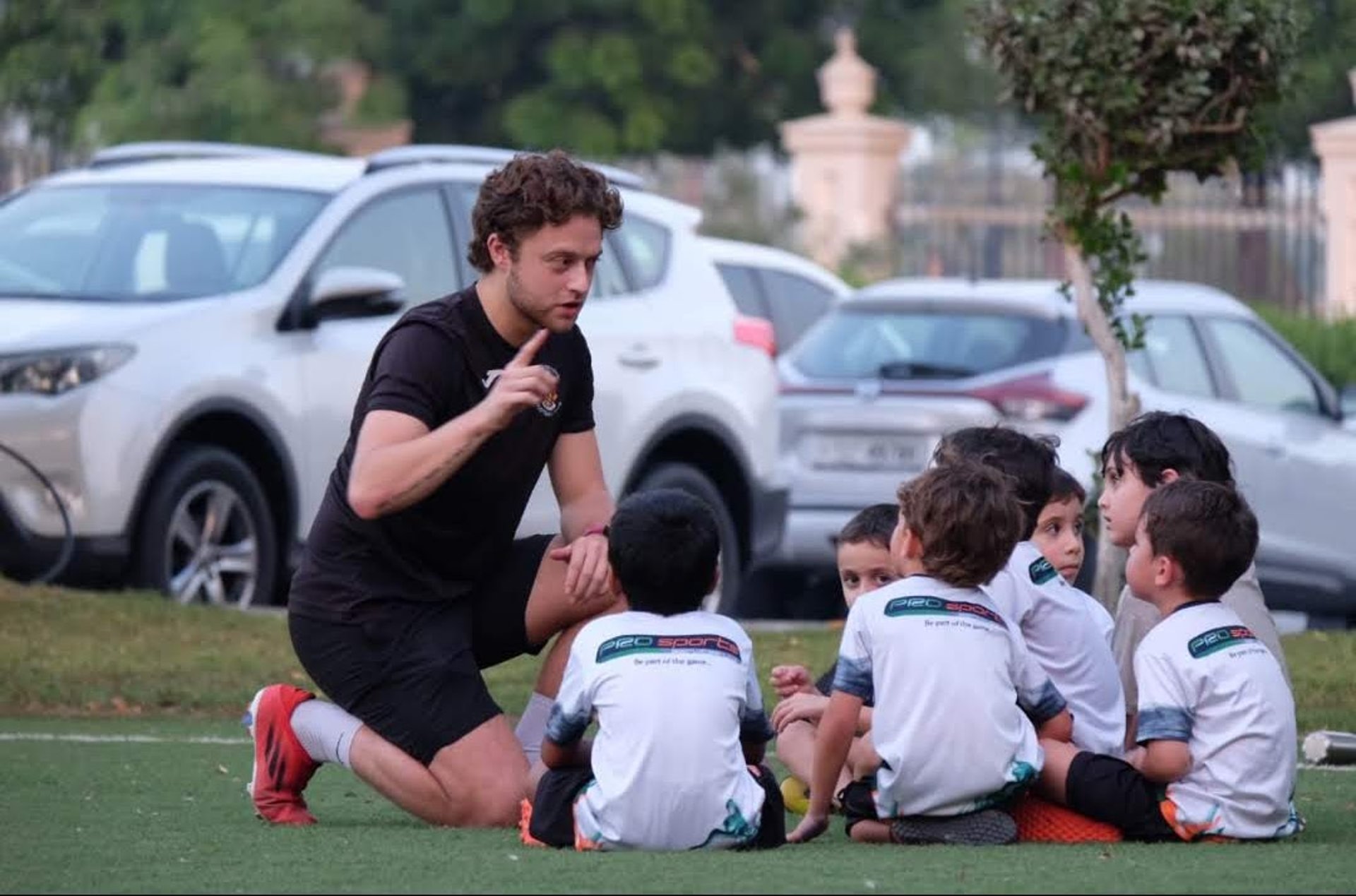 woman wearing yellow long-sleeved dress under white clouds and blue sky during daytime