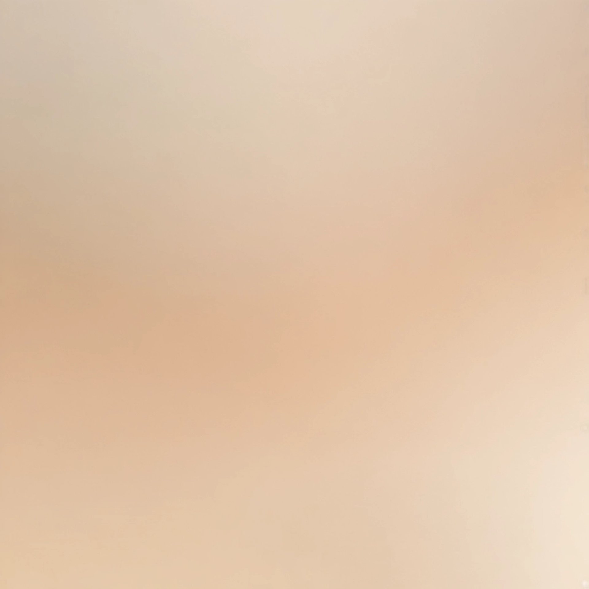 a person riding a snowboard down a snow covered slope