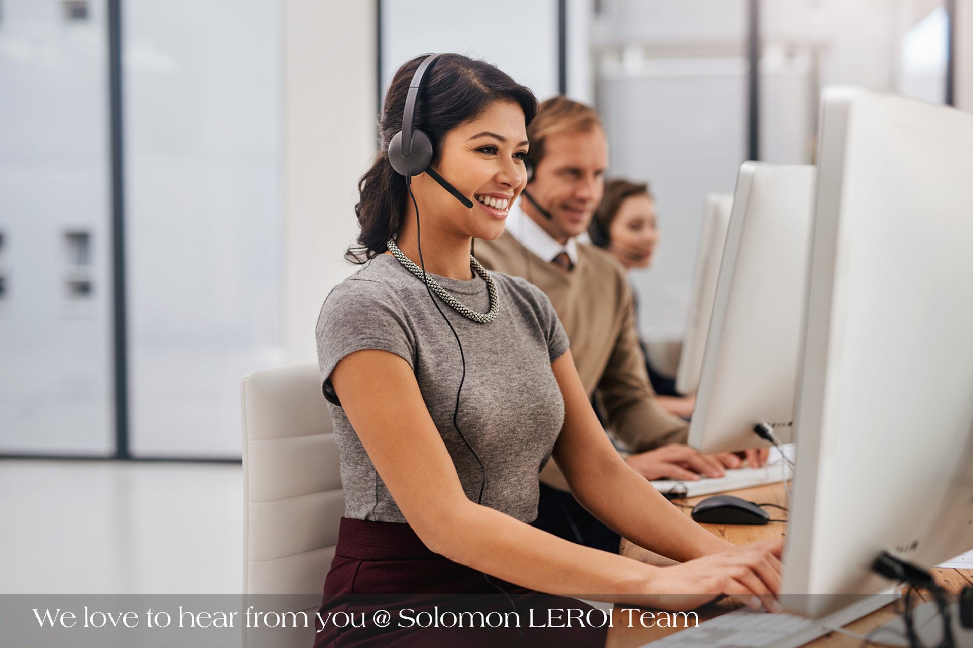 an abstract photo of a curved building with a blue sky in the background