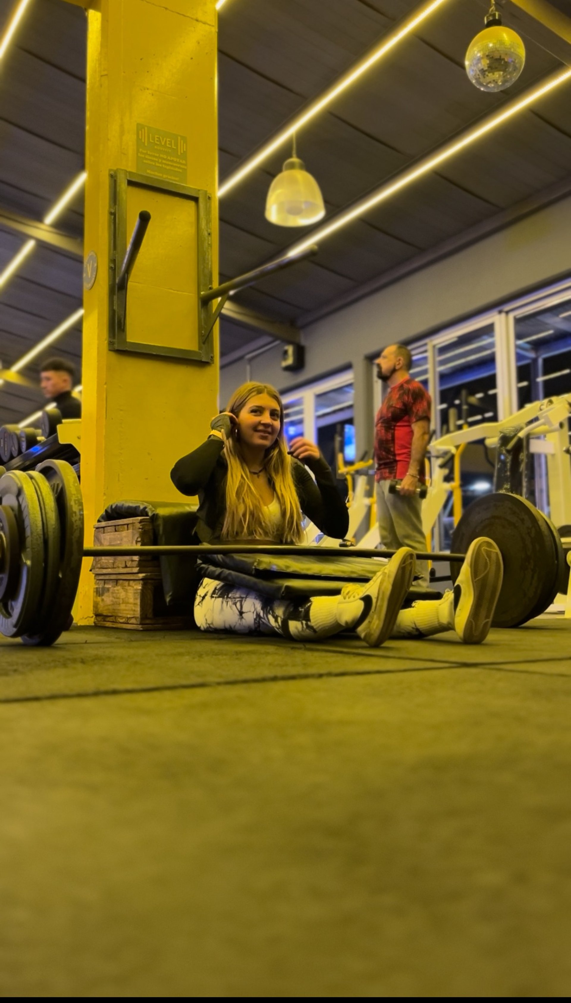 woman wearing yellow long-sleeved dress under white clouds and blue sky during daytime