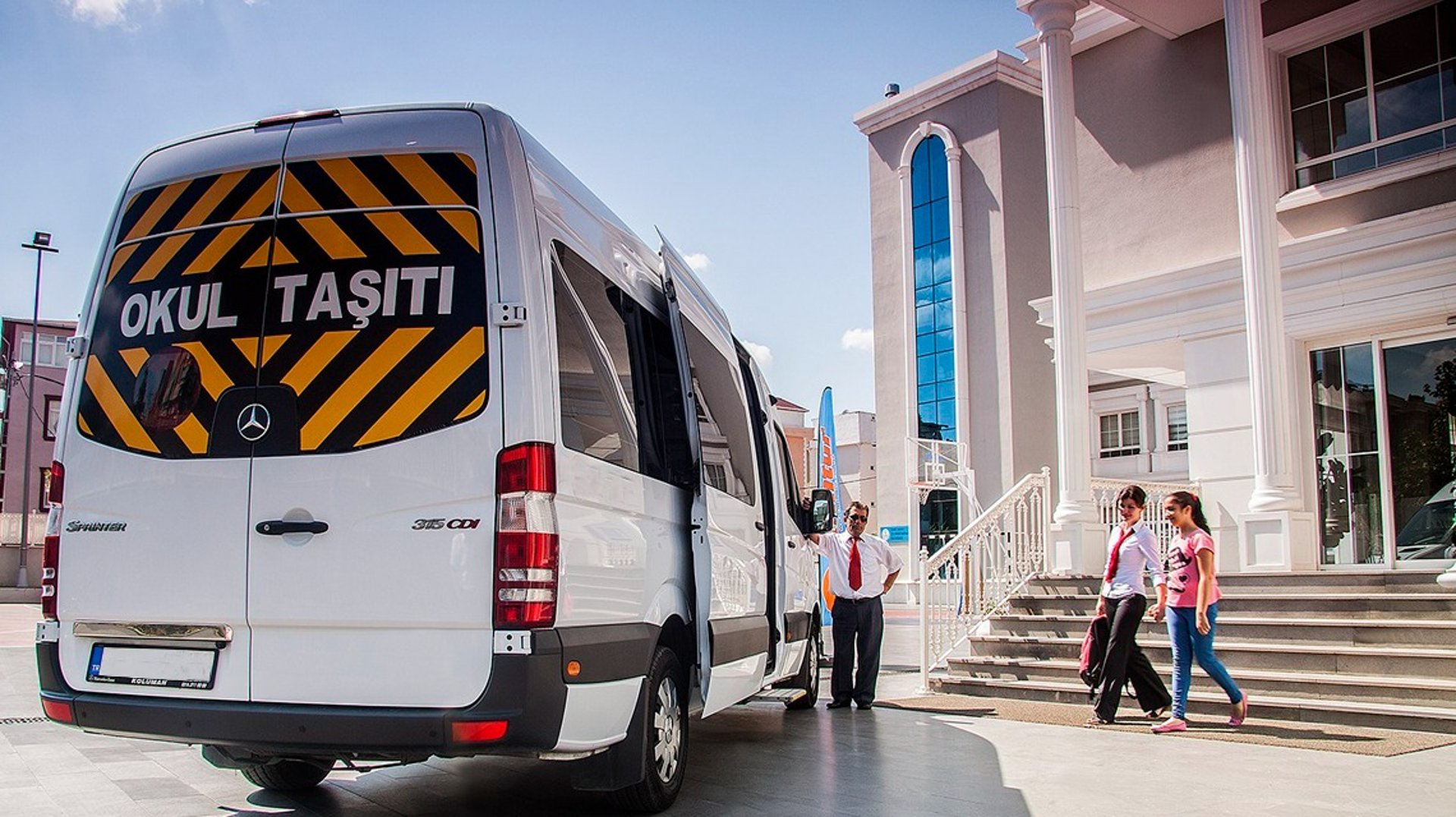 woman wearing yellow long-sleeved dress under white clouds and blue sky during daytime