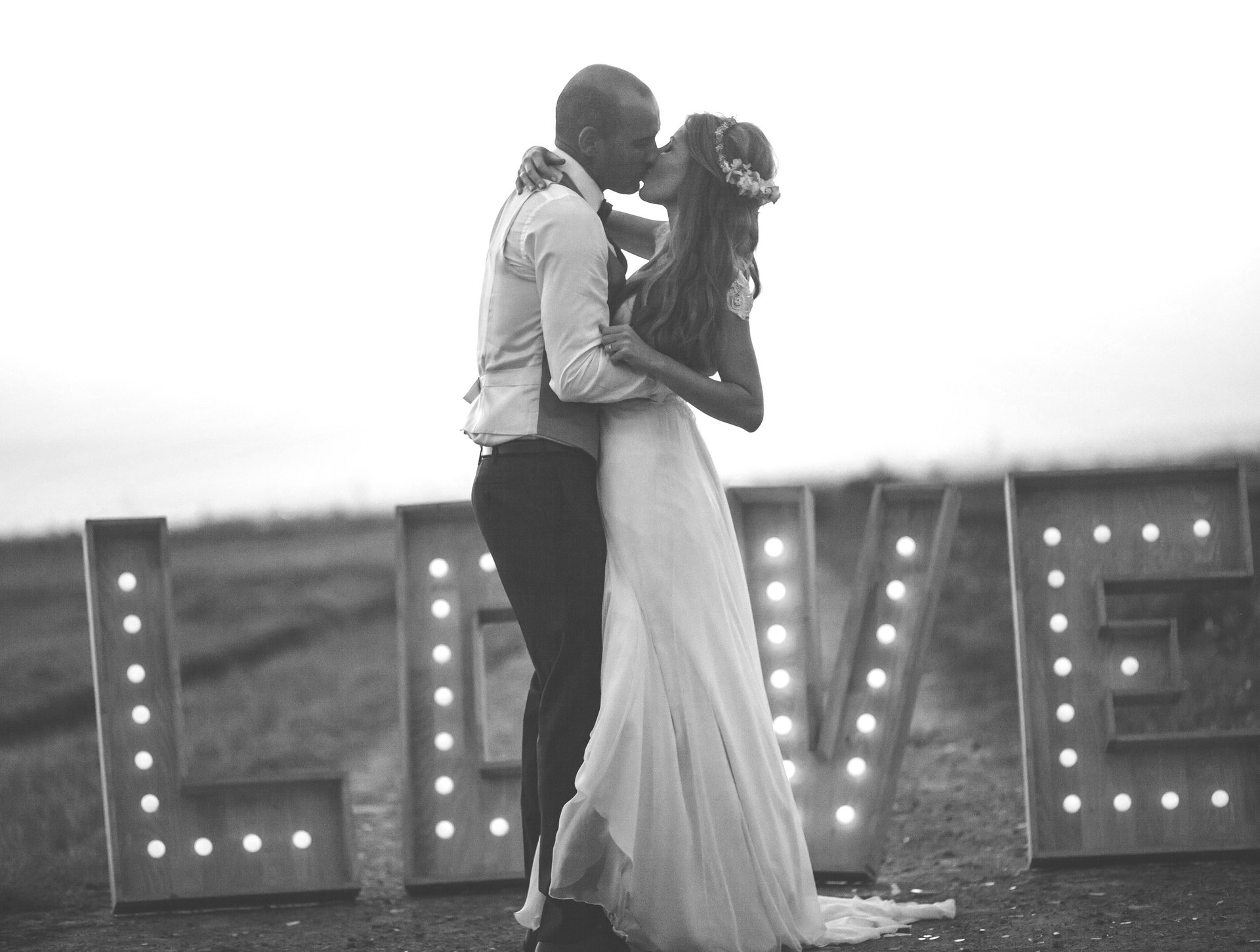 an abstract photo of a curved building with a blue sky in the background