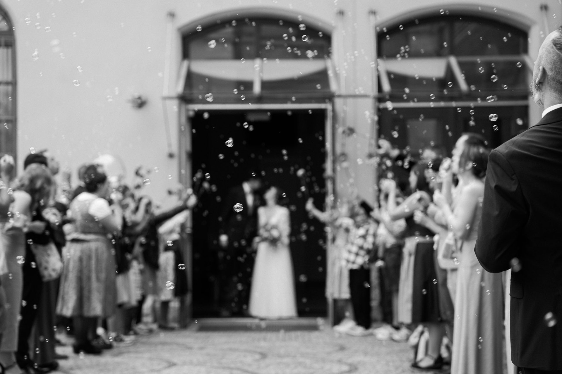 grayscale shot of bride and groom