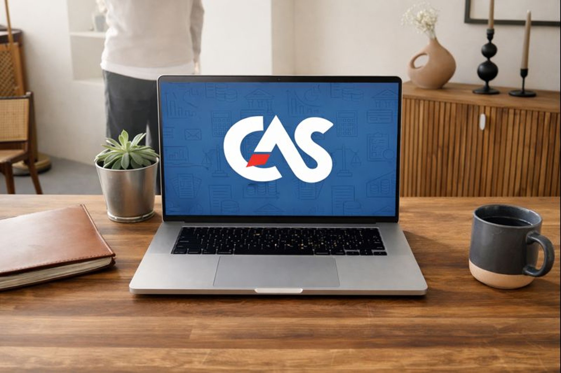 man sitting near table with laptop and smartphone near window