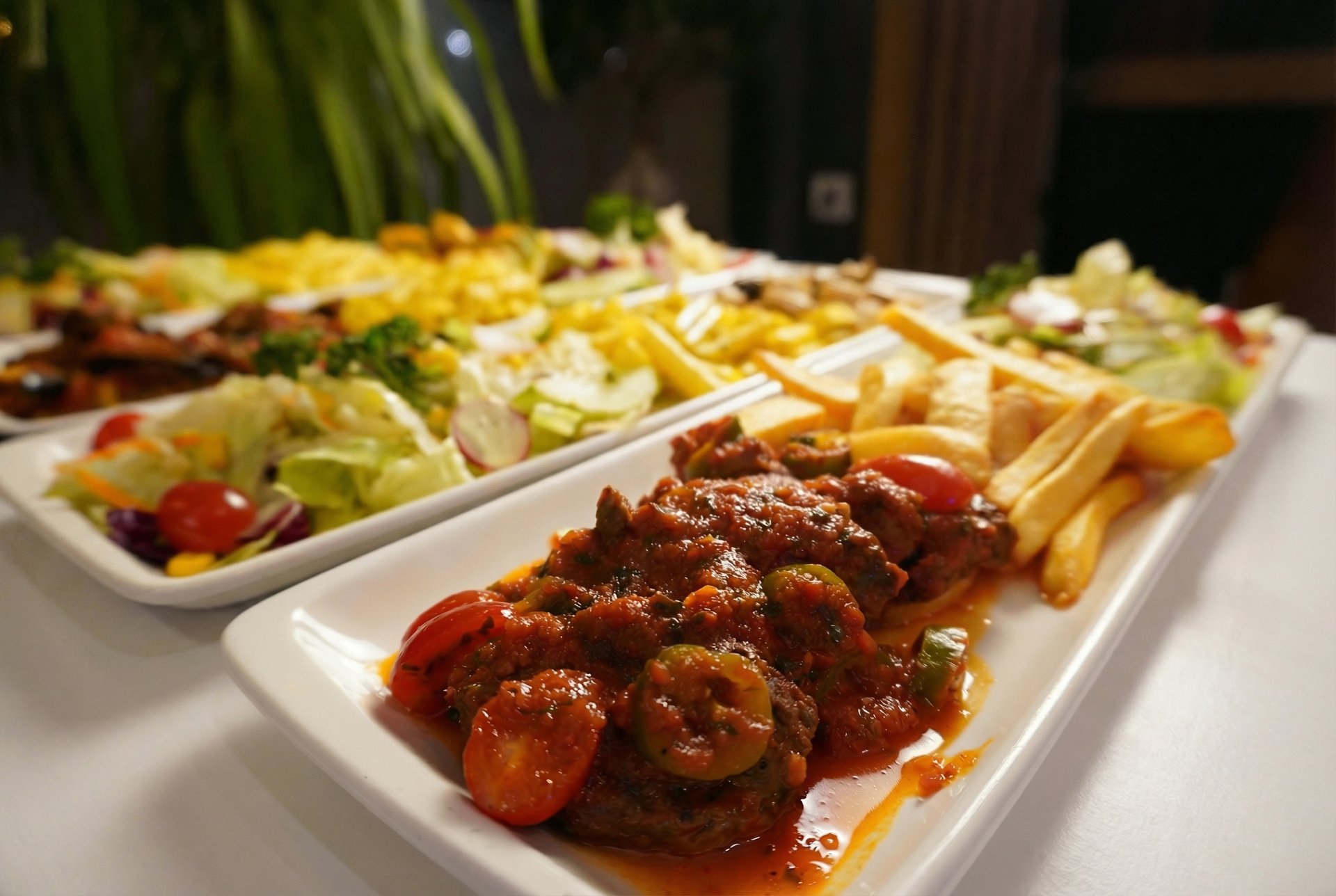 an abstract photo of a curved building with a blue sky in the background