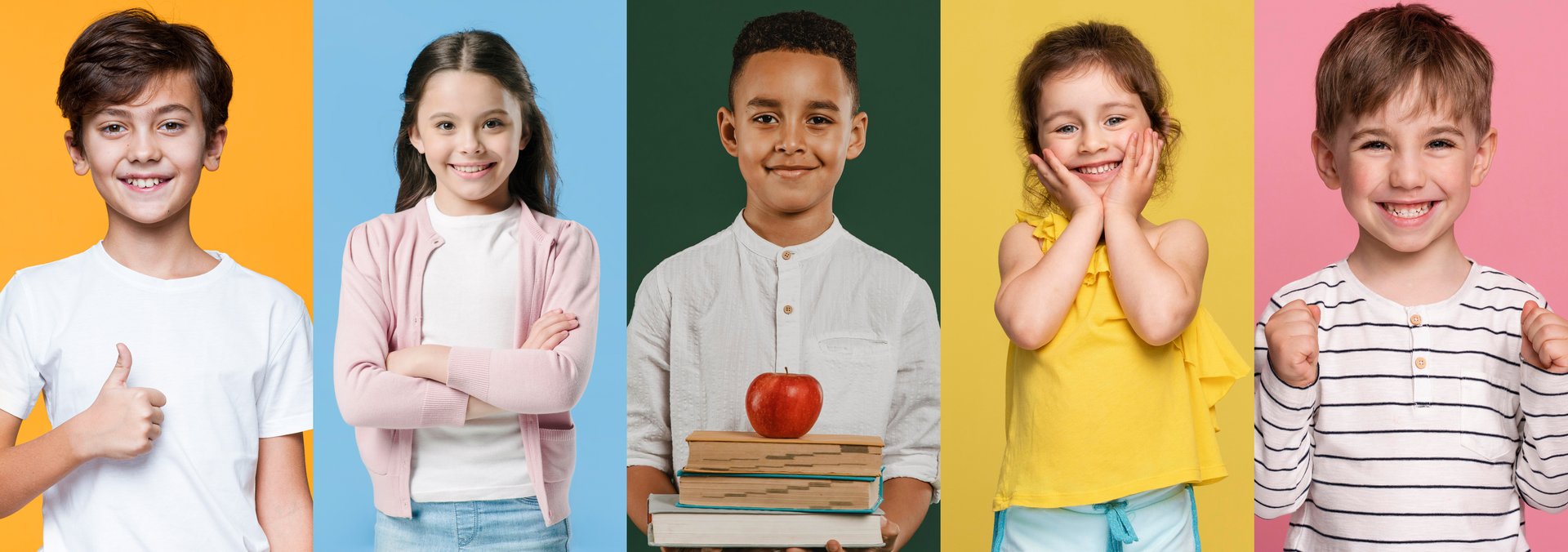 Three young boys in orange shirts standing together