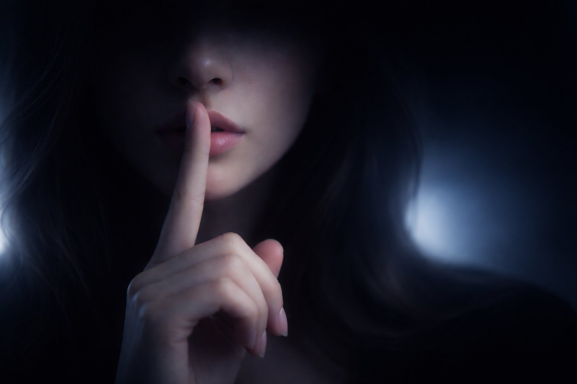 grayscale photo of woman doing silent hand sign