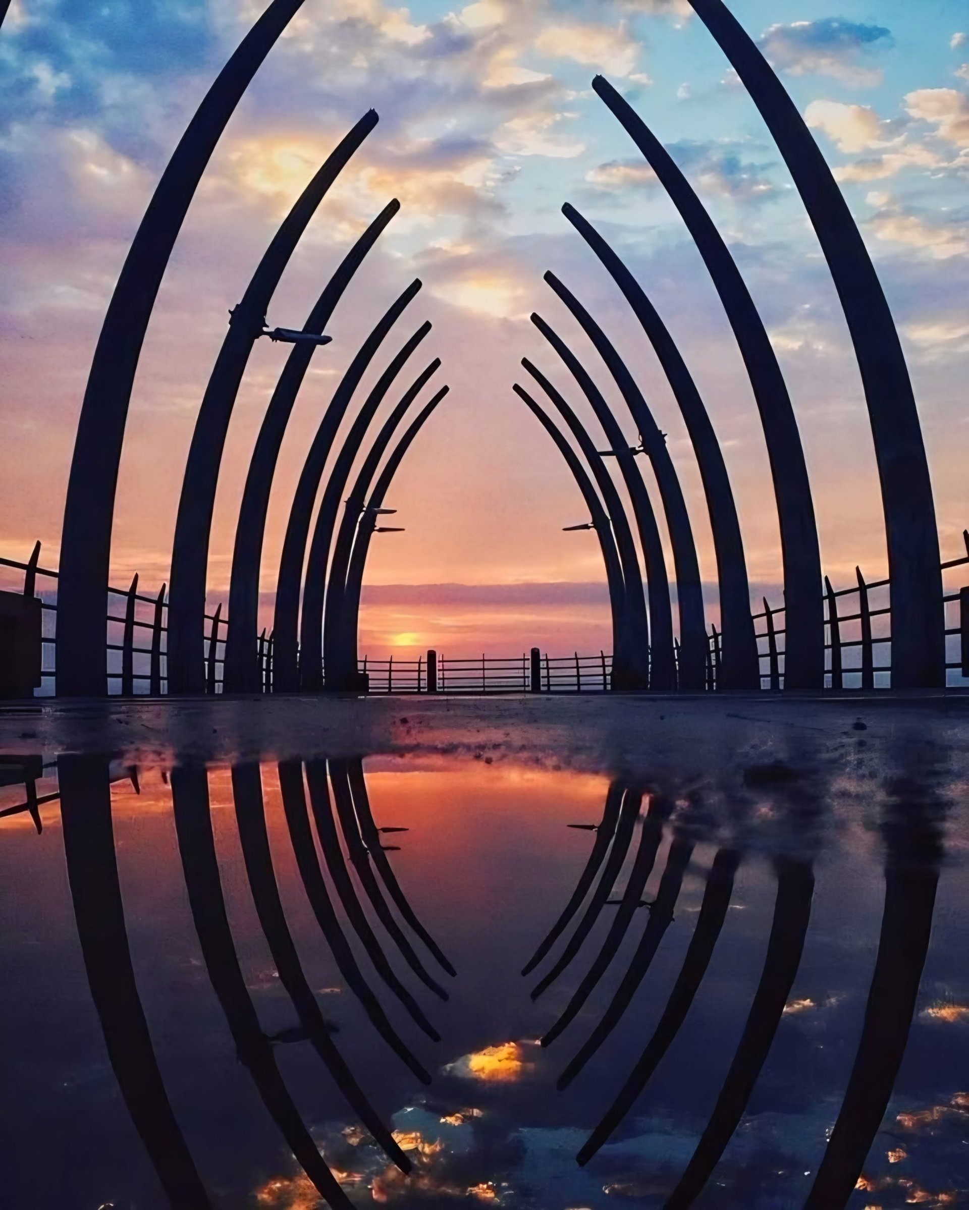 woman wearing yellow long-sleeved dress under white clouds and blue sky during daytime