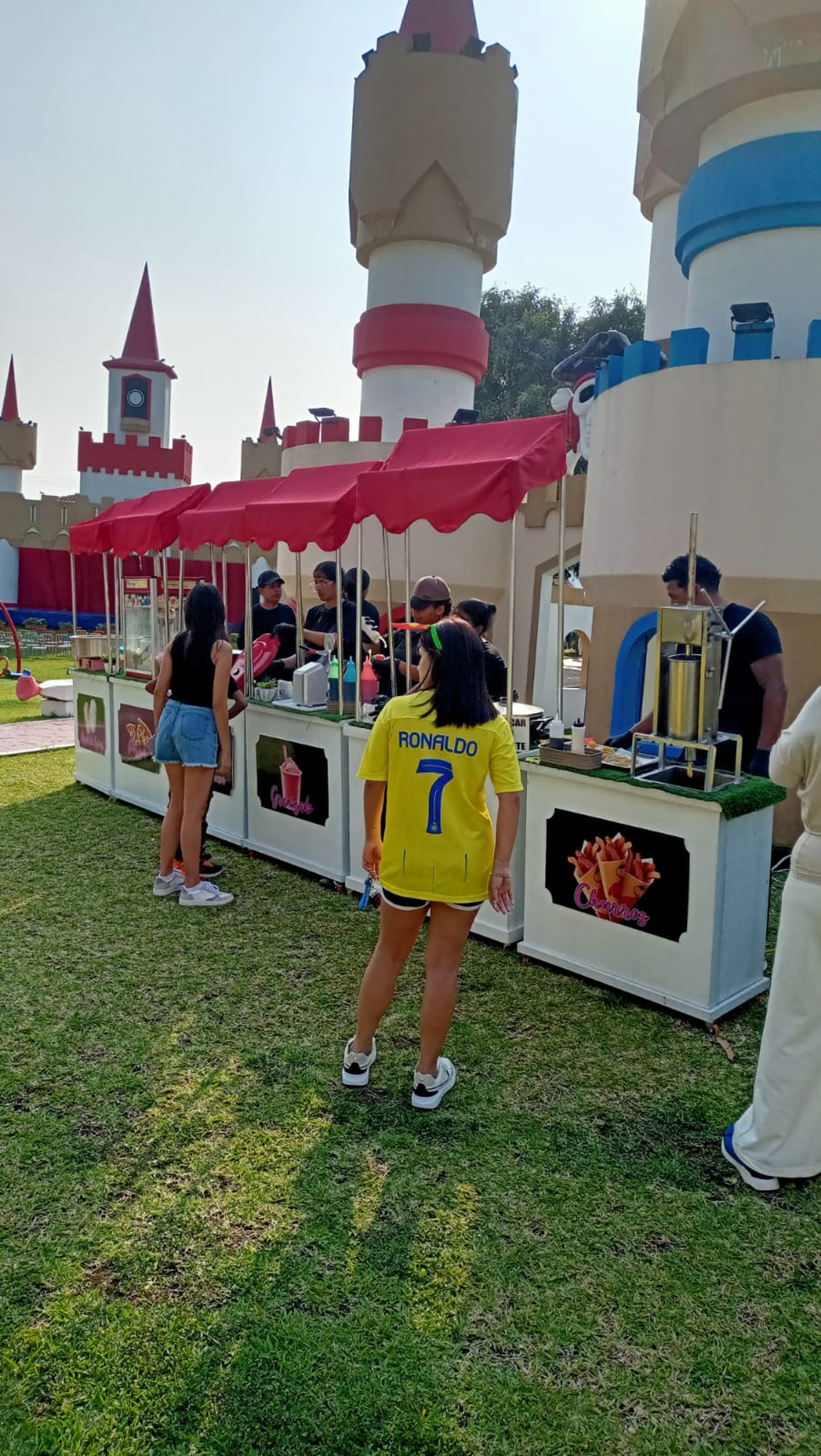 woman wearing yellow long-sleeved dress under white clouds and blue sky during daytime