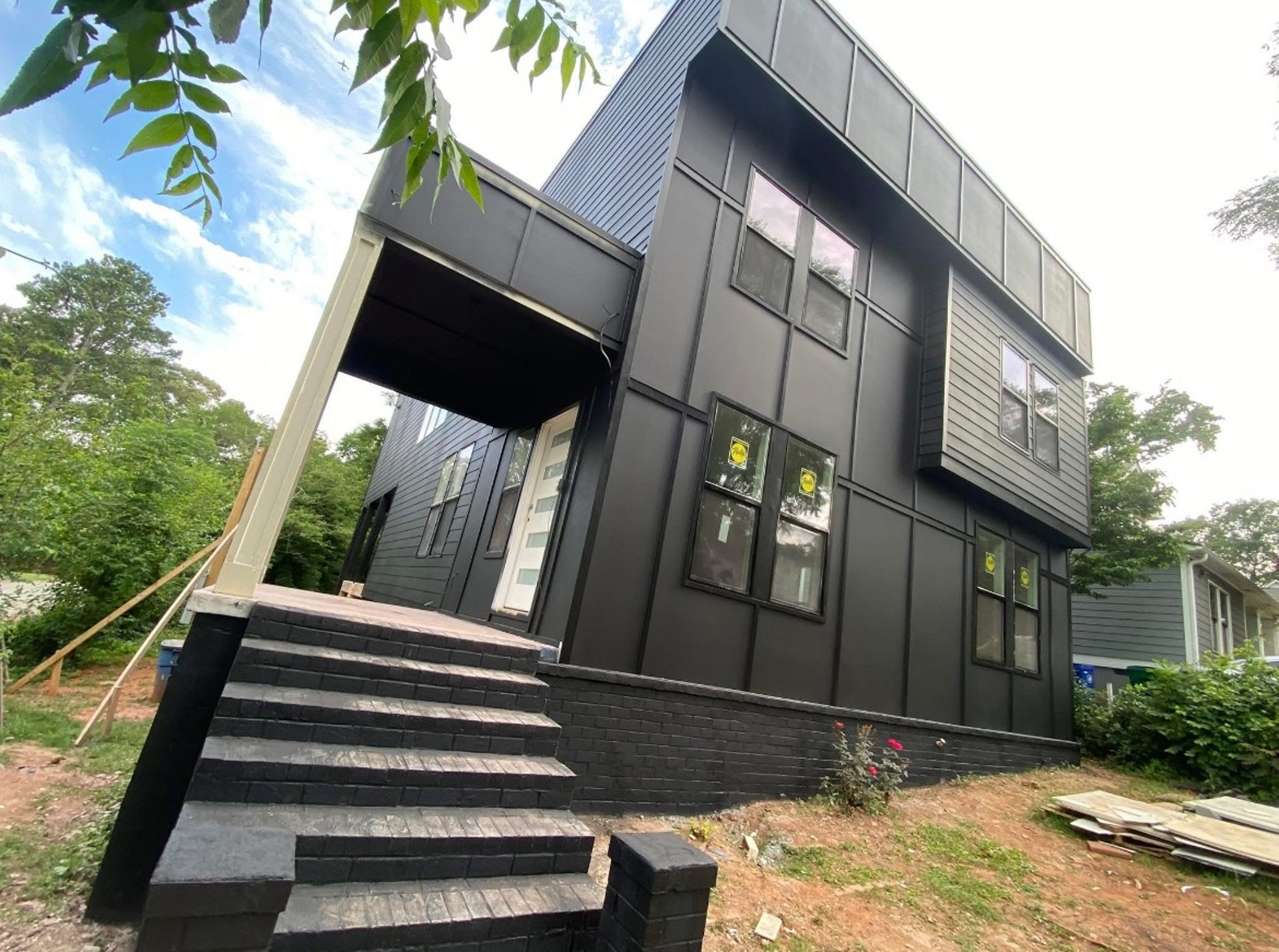 black and brown leather padded tub sofa