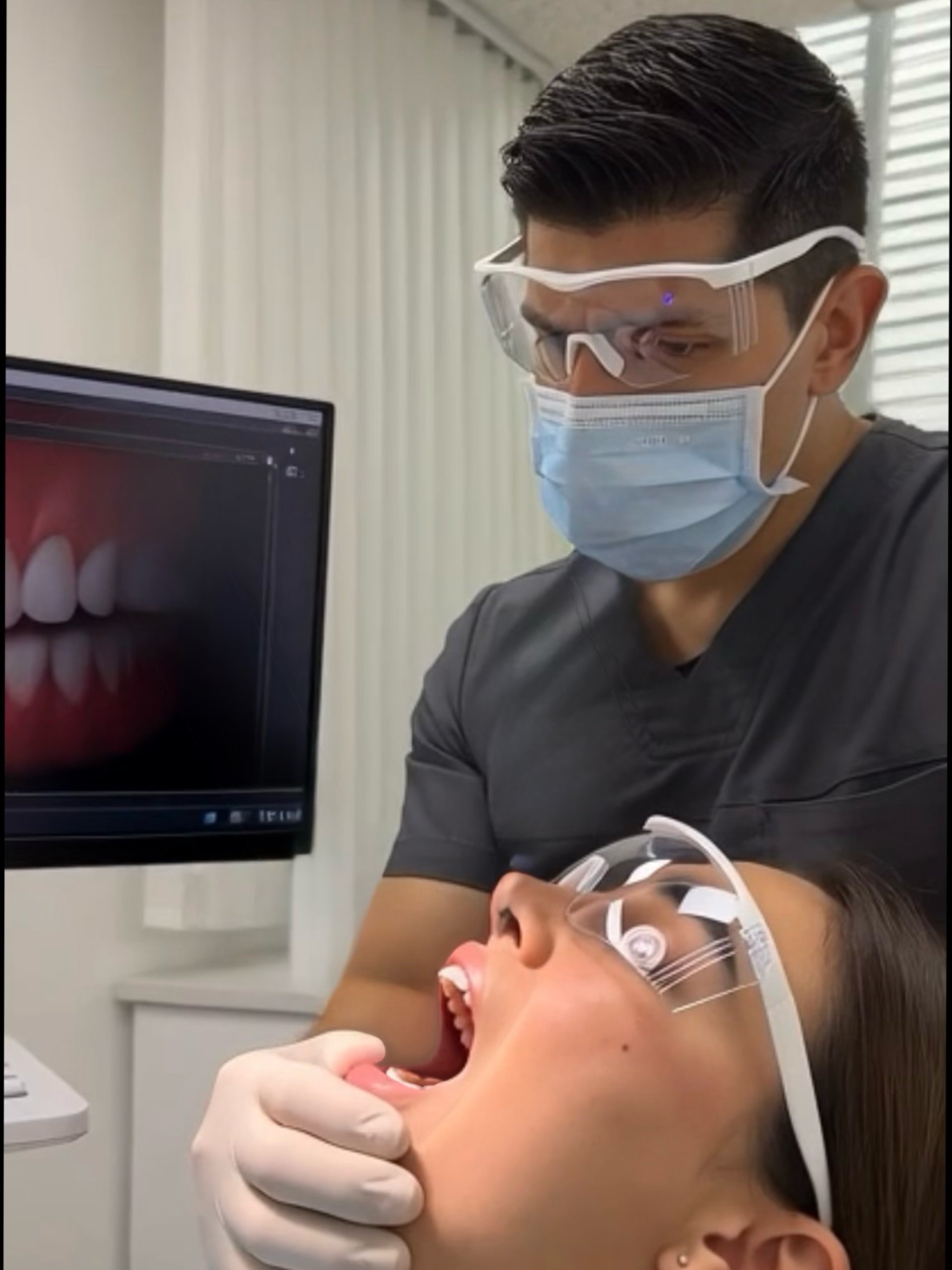an abstract photo of a curved building with a blue sky in the background