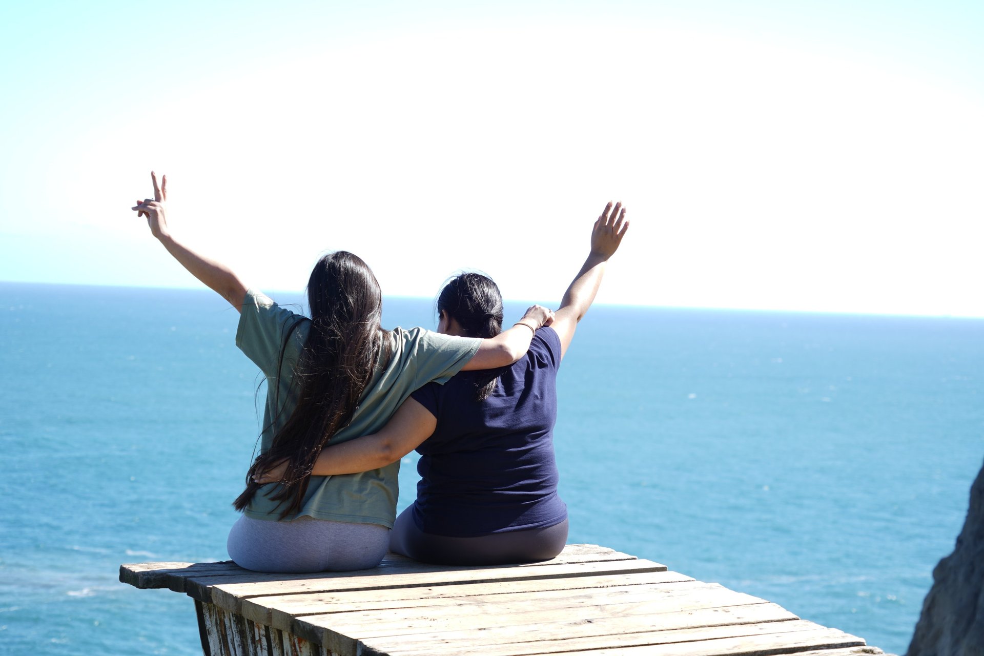 woman wearing yellow long-sleeved dress under white clouds and blue sky during daytime