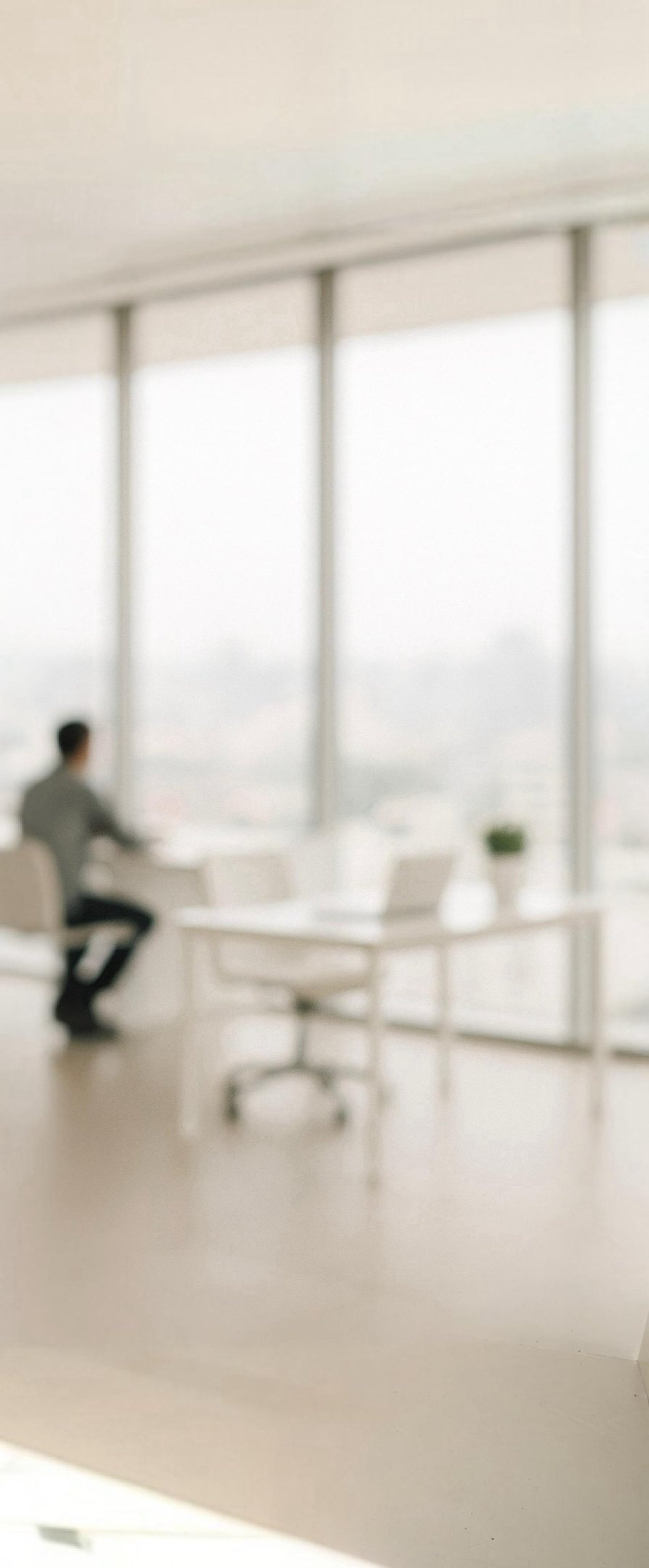 an abstract photo of a curved building with a blue sky in the background