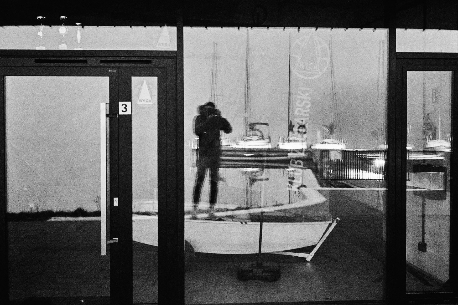 an abstract photo of a curved building with a blue sky in the background