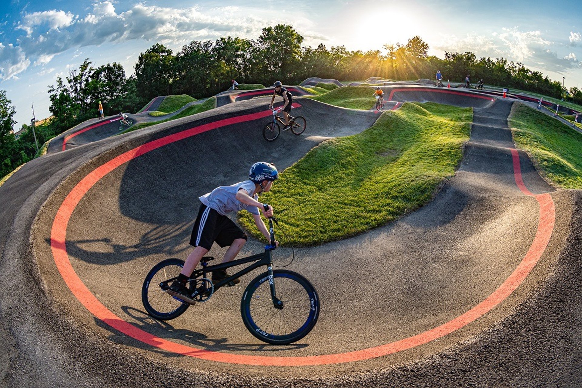 Empty skate park with red and white caution tape.