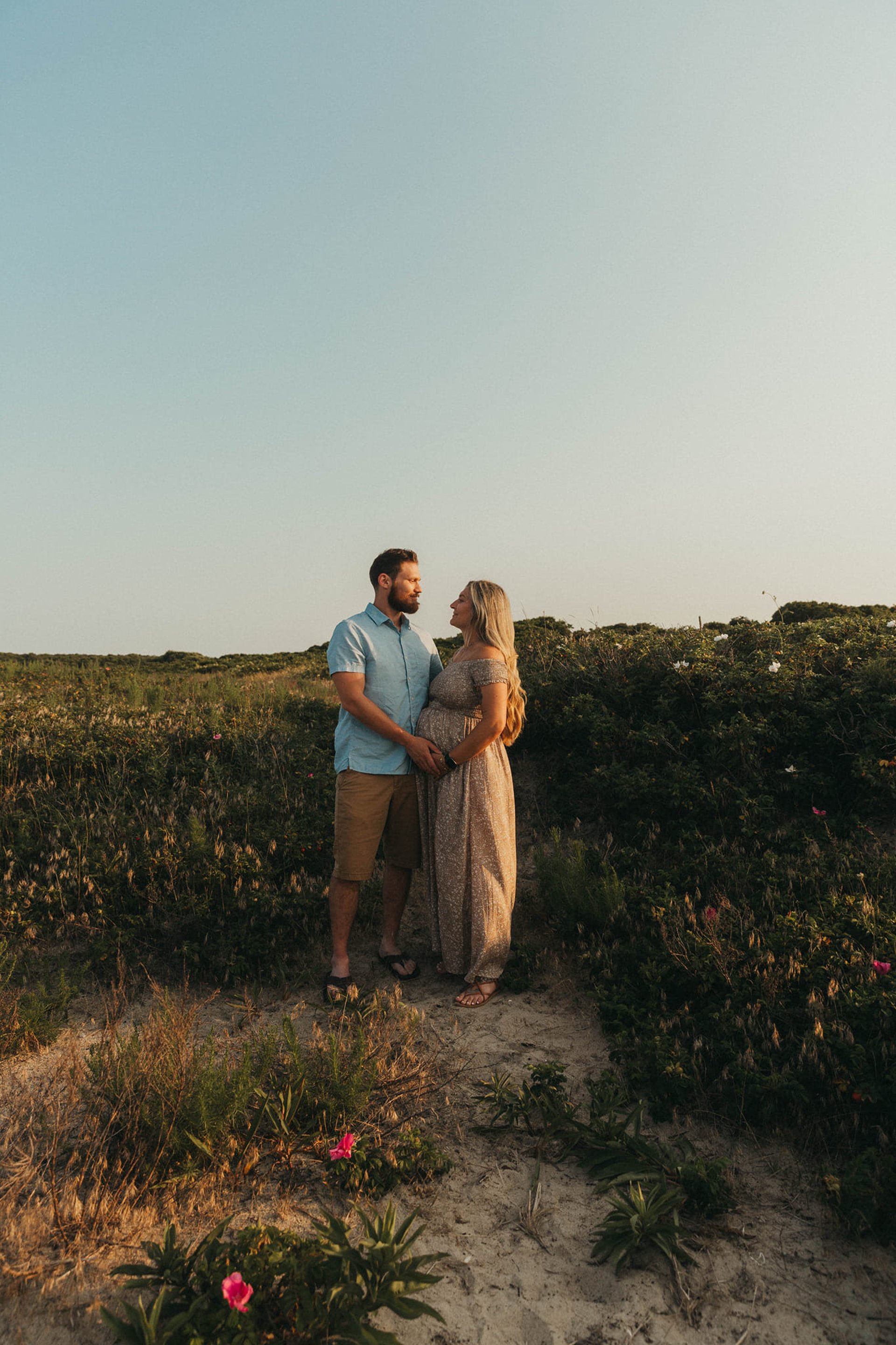 a black and white photo of a drape with flowers hanging from it