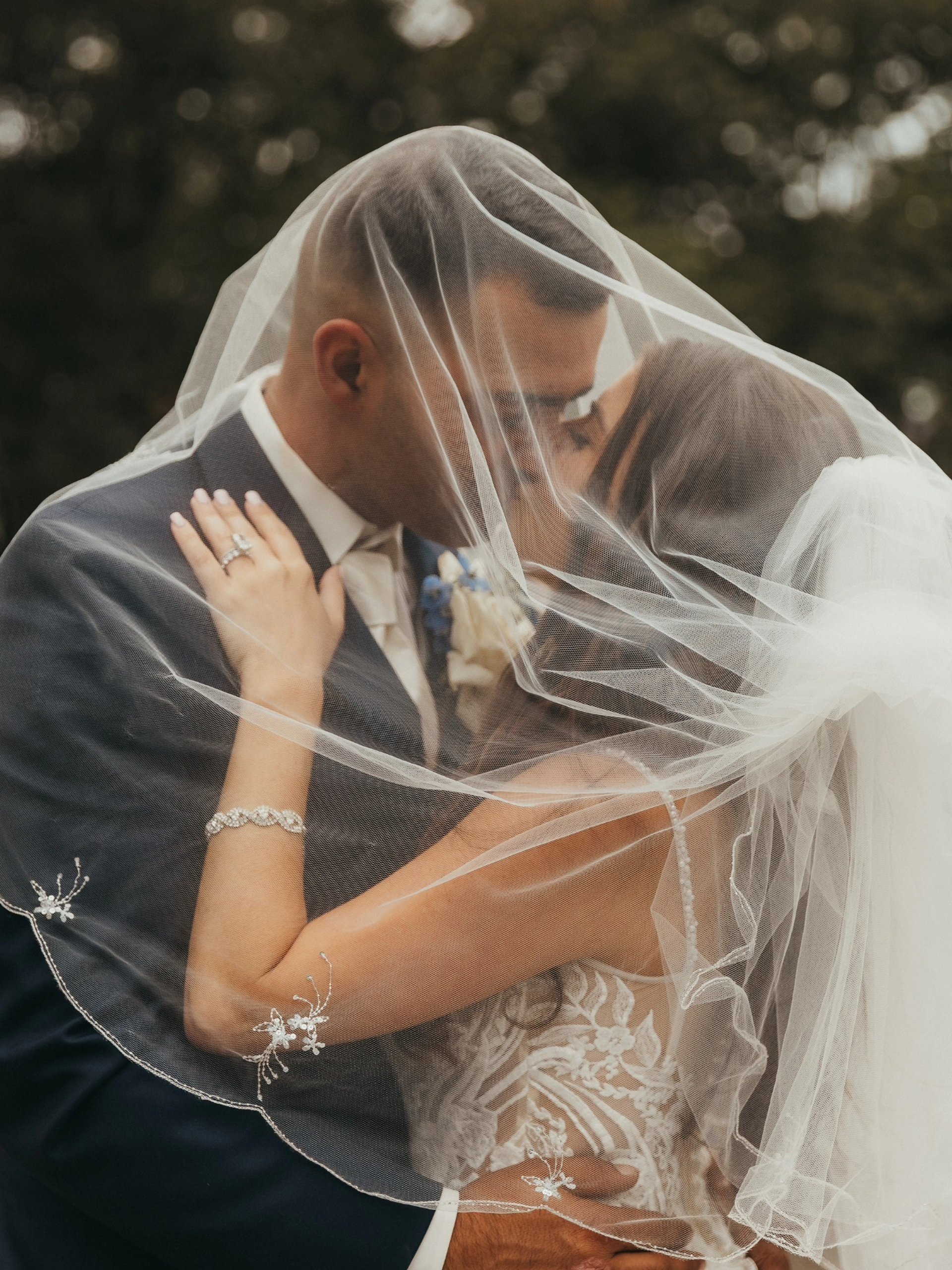 a black and white photo of a drape with flowers hanging from it