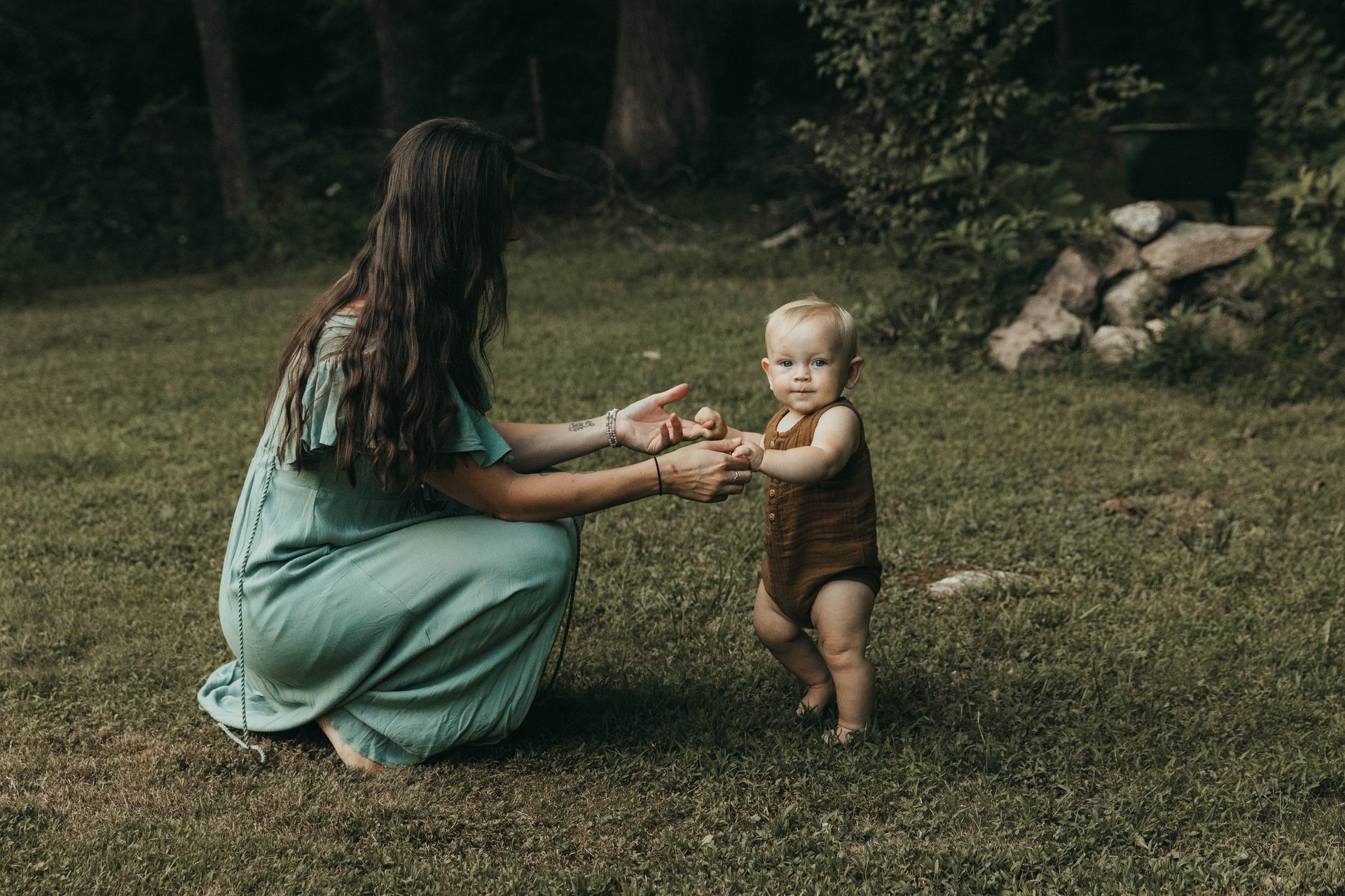 a black and white photo of a drape with flowers hanging from it