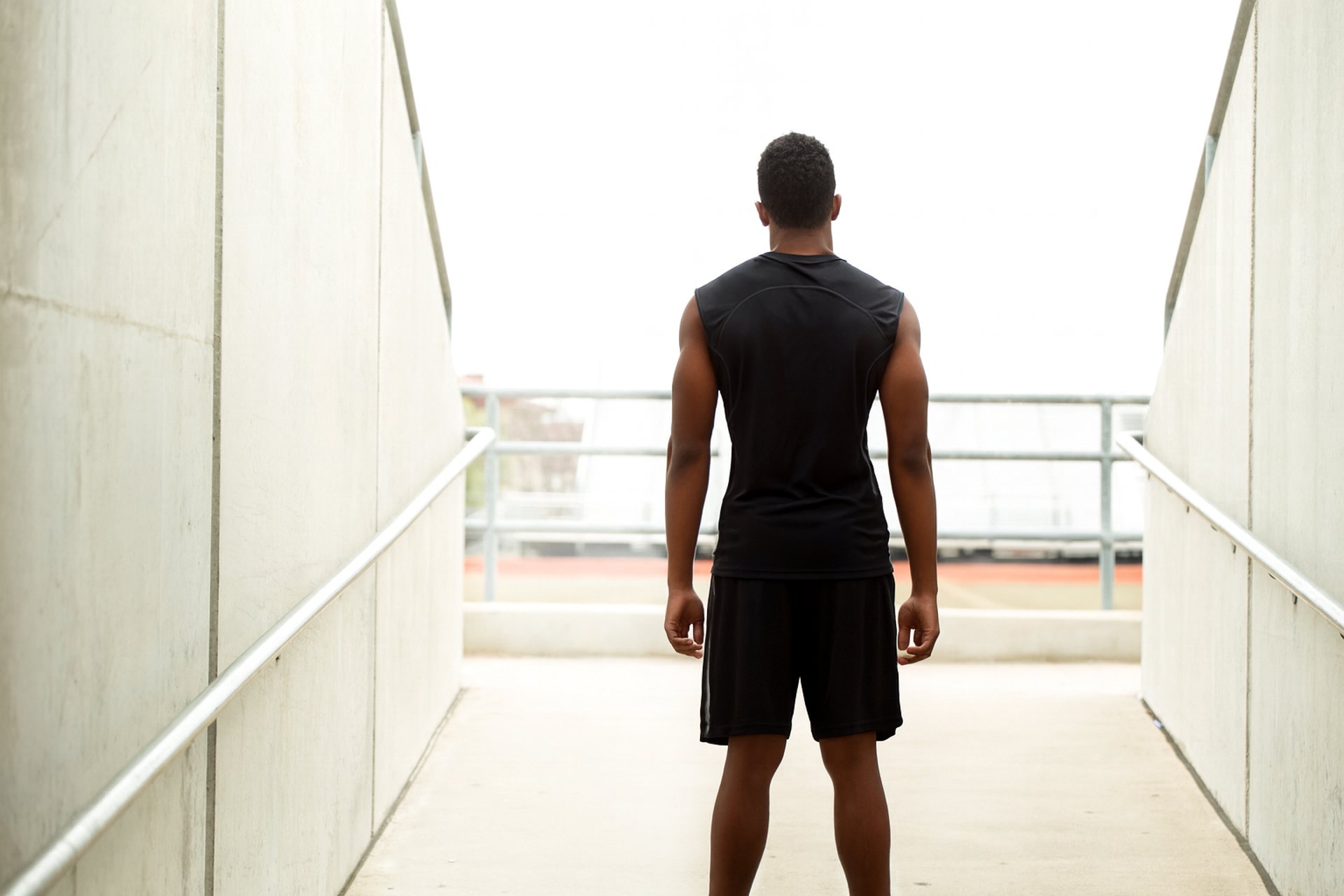 an abstract photo of a curved building with a blue sky in the background