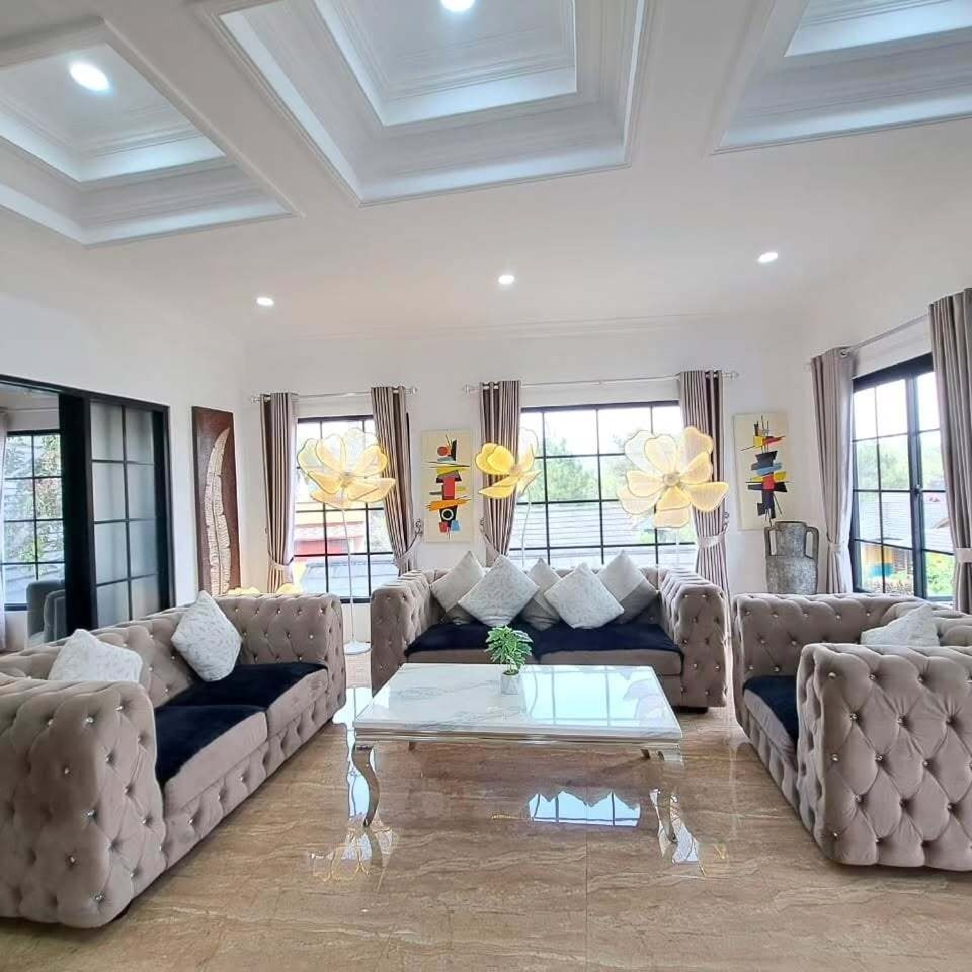 a living room filled with furniture and a mirror