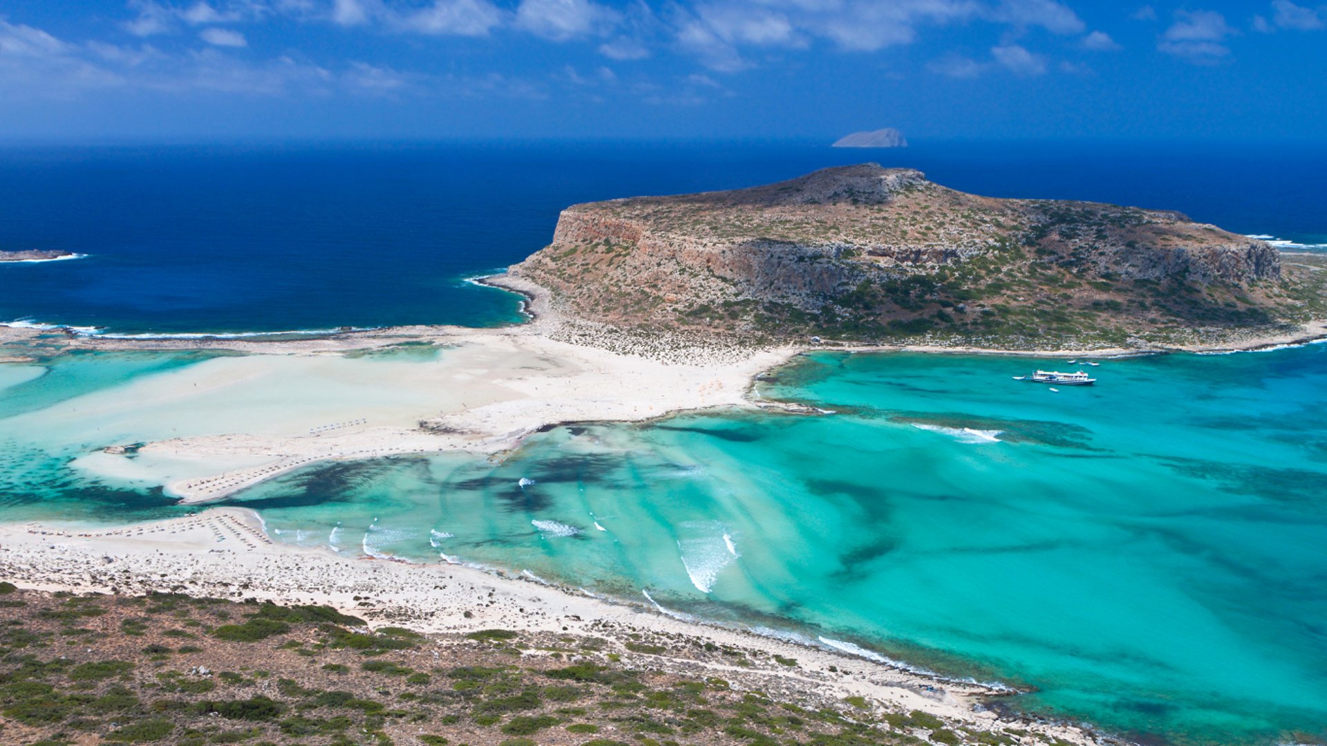 an abstract photo of a curved building with a blue sky in the background