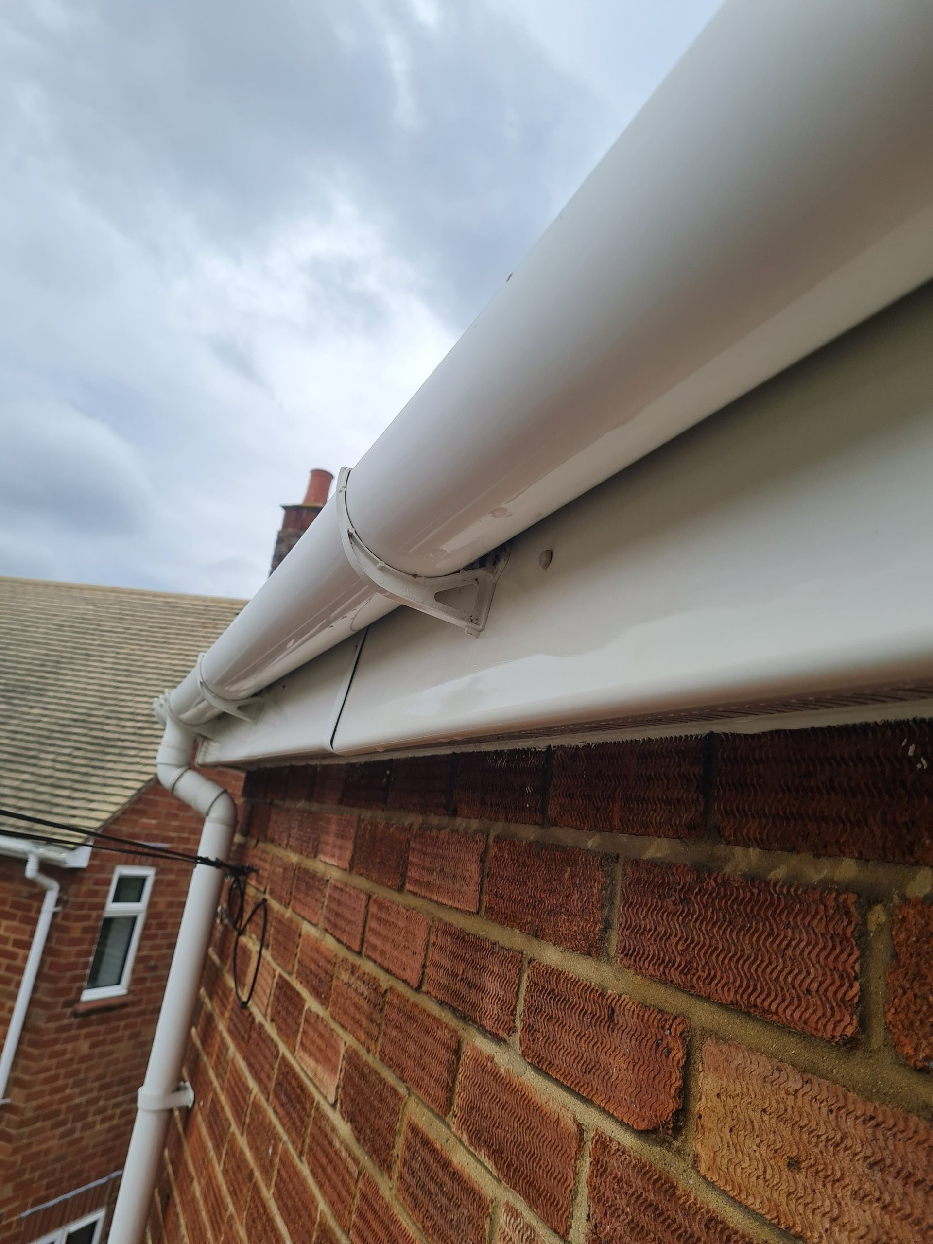 an abstract photo of a curved building with a blue sky in the background