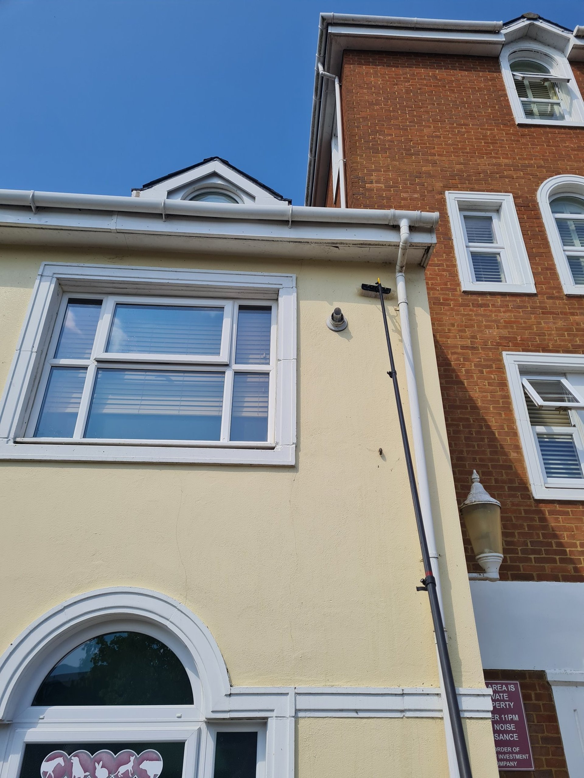 an abstract photo of a curved building with a blue sky in the background
