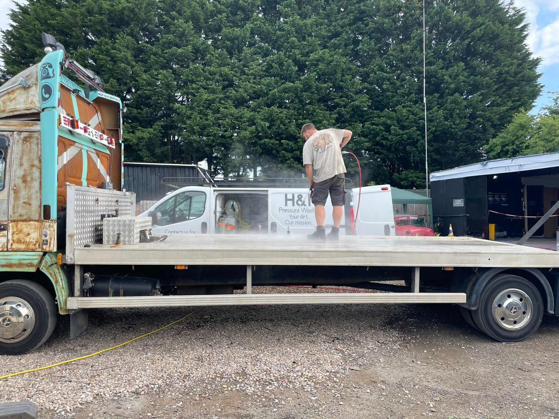 Pressure washing bed of truck