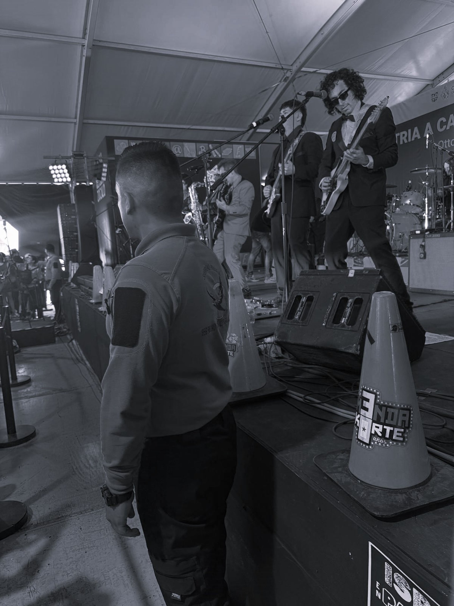 a man sitting in front of multiple monitors