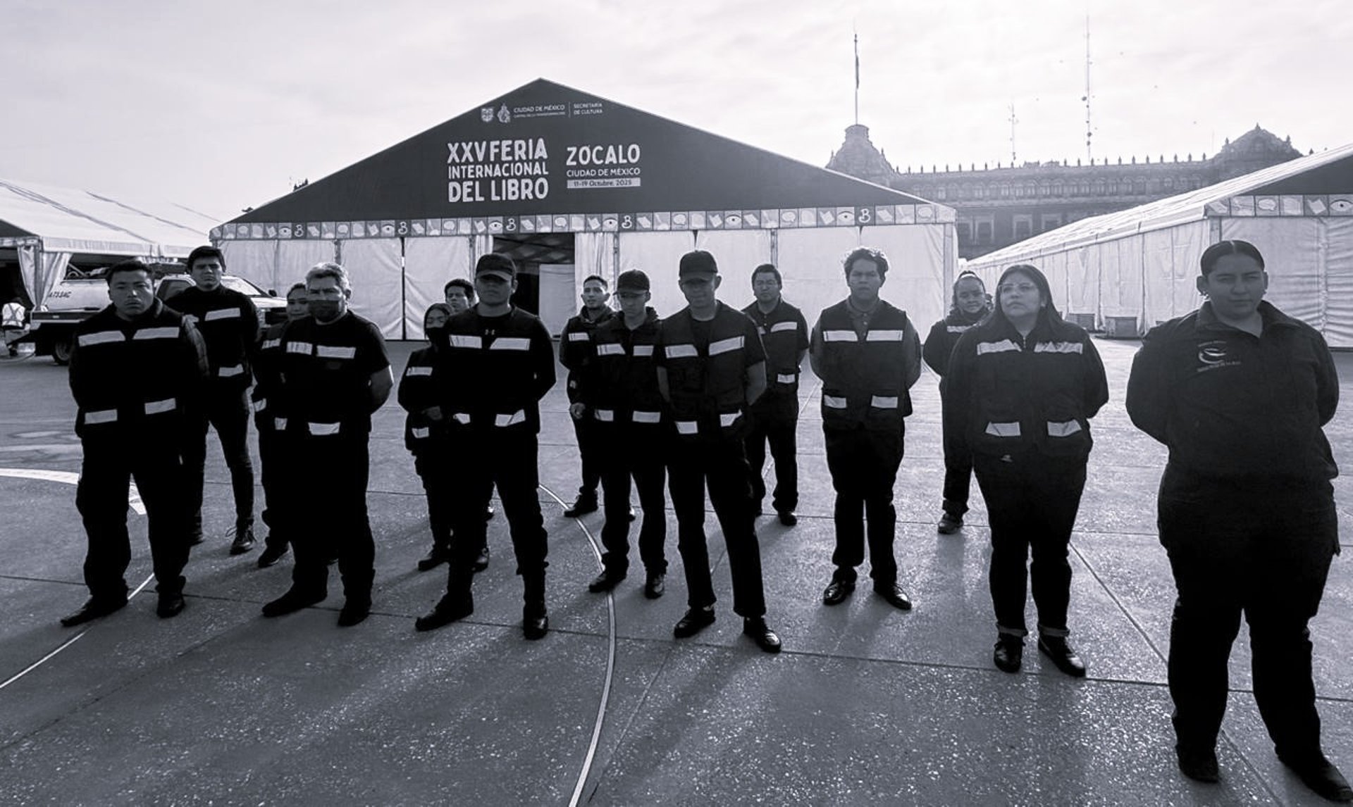 A policeman walks away down a street.
