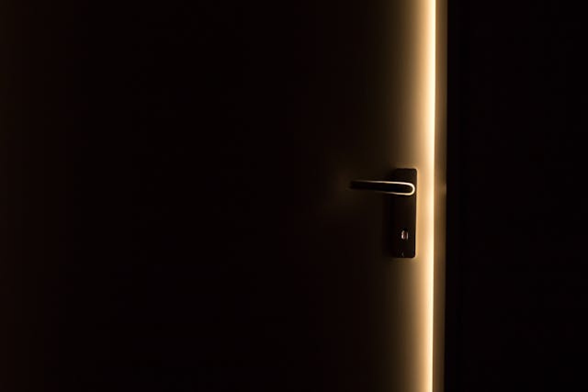 a close up of a black and brown abstract painting