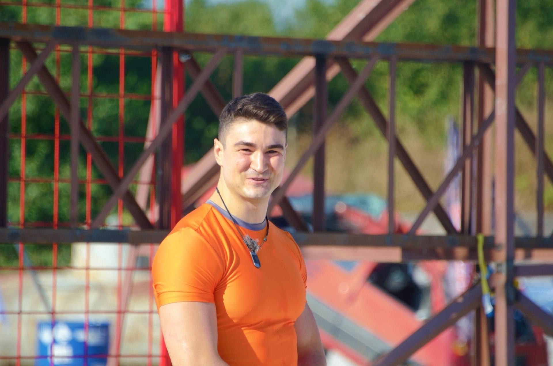 man in black t-shirt and black shorts running on road during daytime