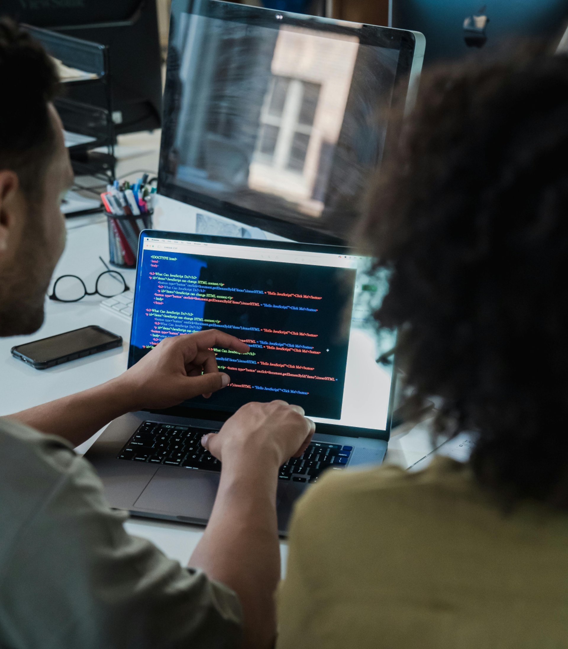 Students studying together at a long table.