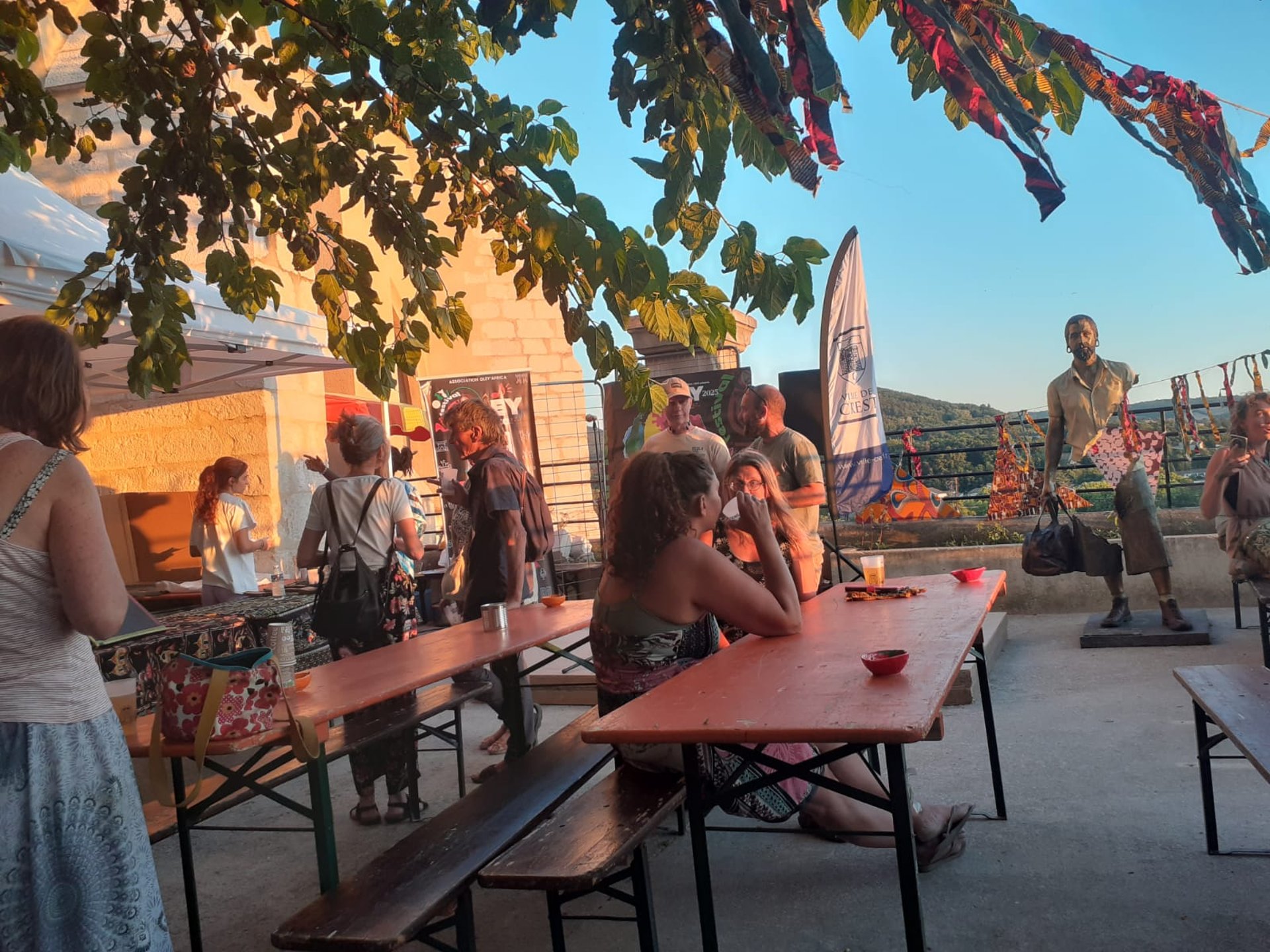 woman wearing yellow long-sleeved dress under white clouds and blue sky during daytime