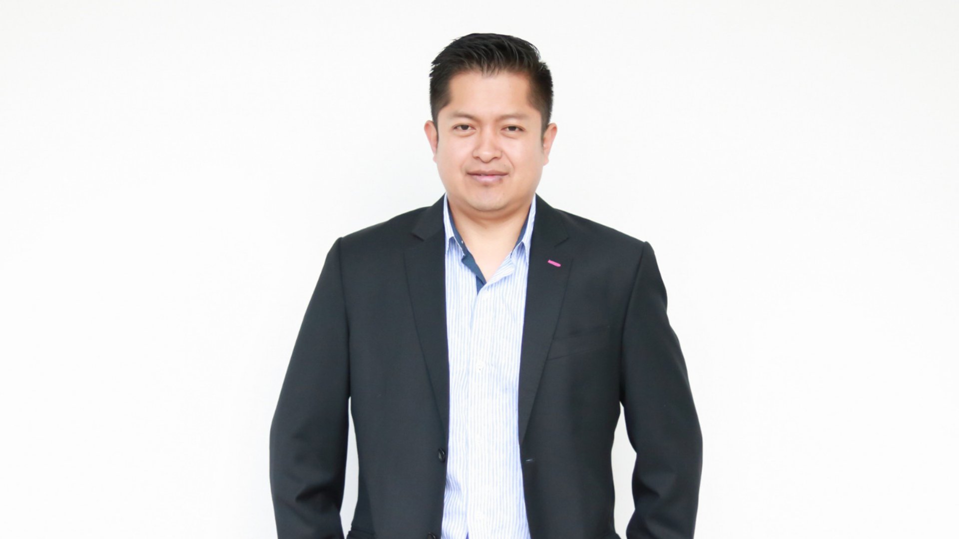 an abstract photo of a curved building with a blue sky in the background