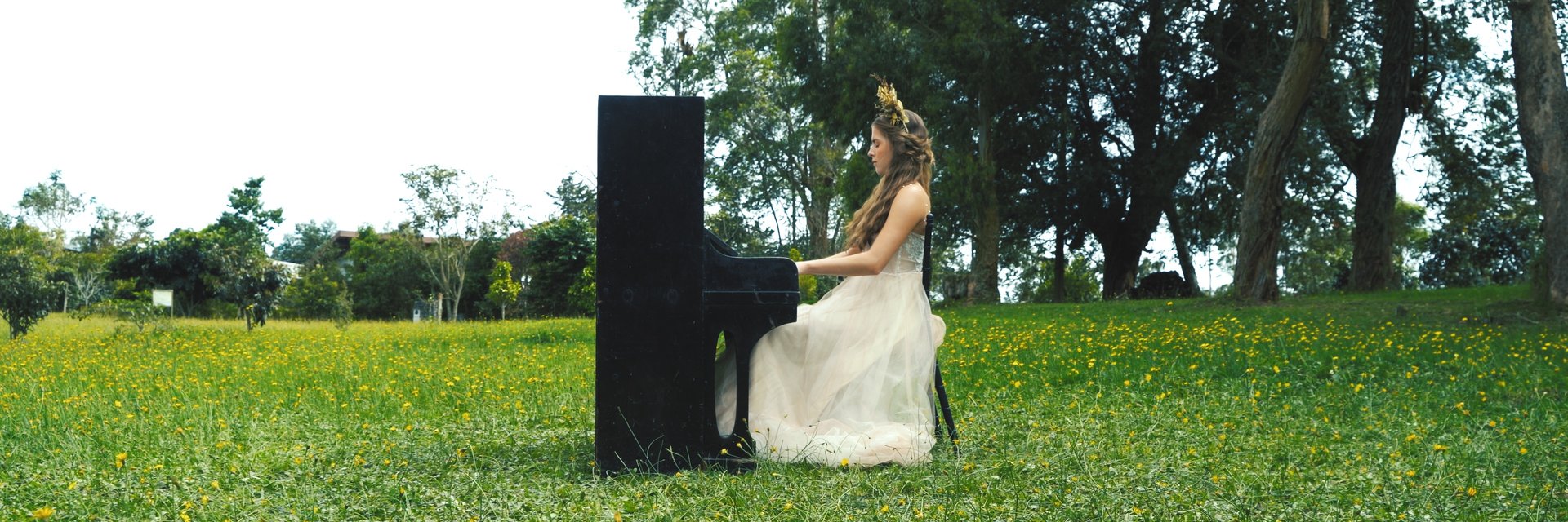 an abstract photo of a curved building with a blue sky in the background