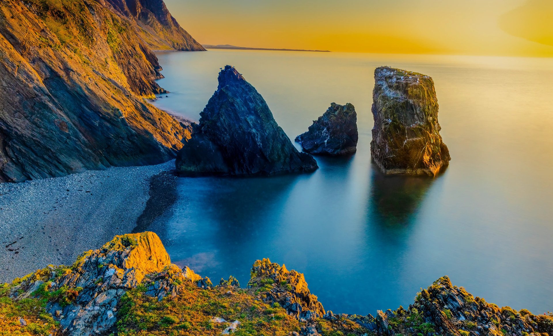 sea stacks at trefor sunset mounmtains