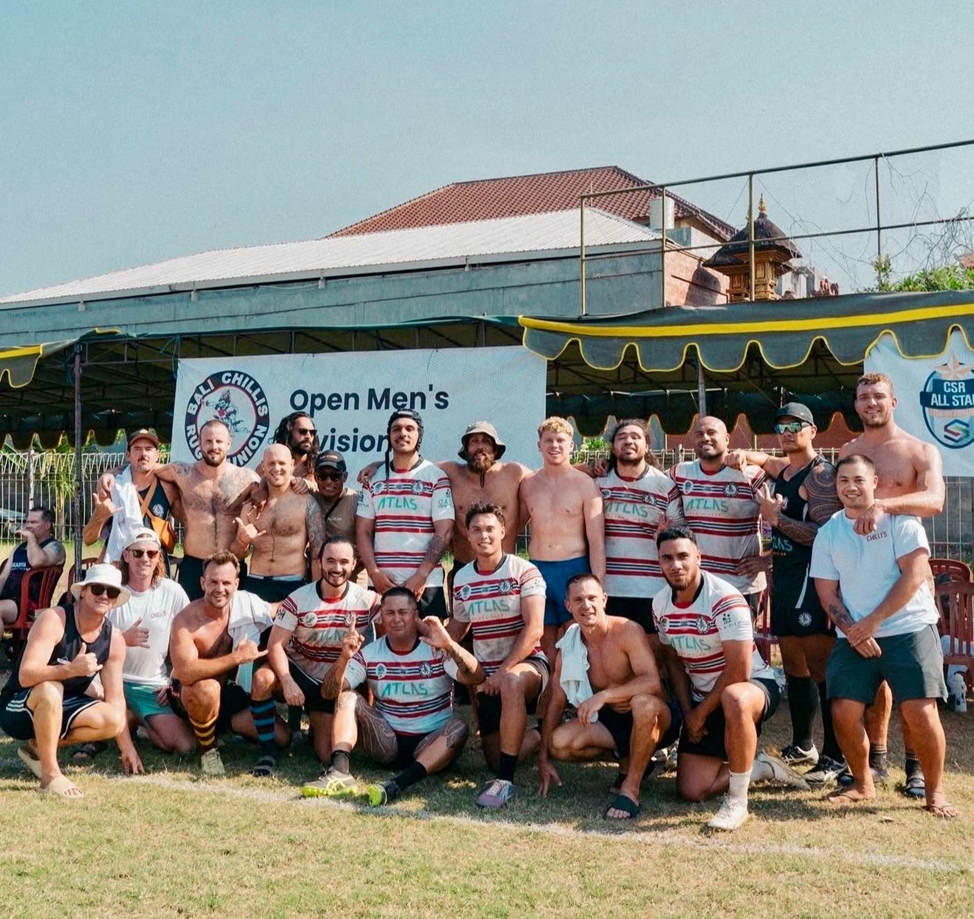 an abstract photo of a curved building with a blue sky in the background