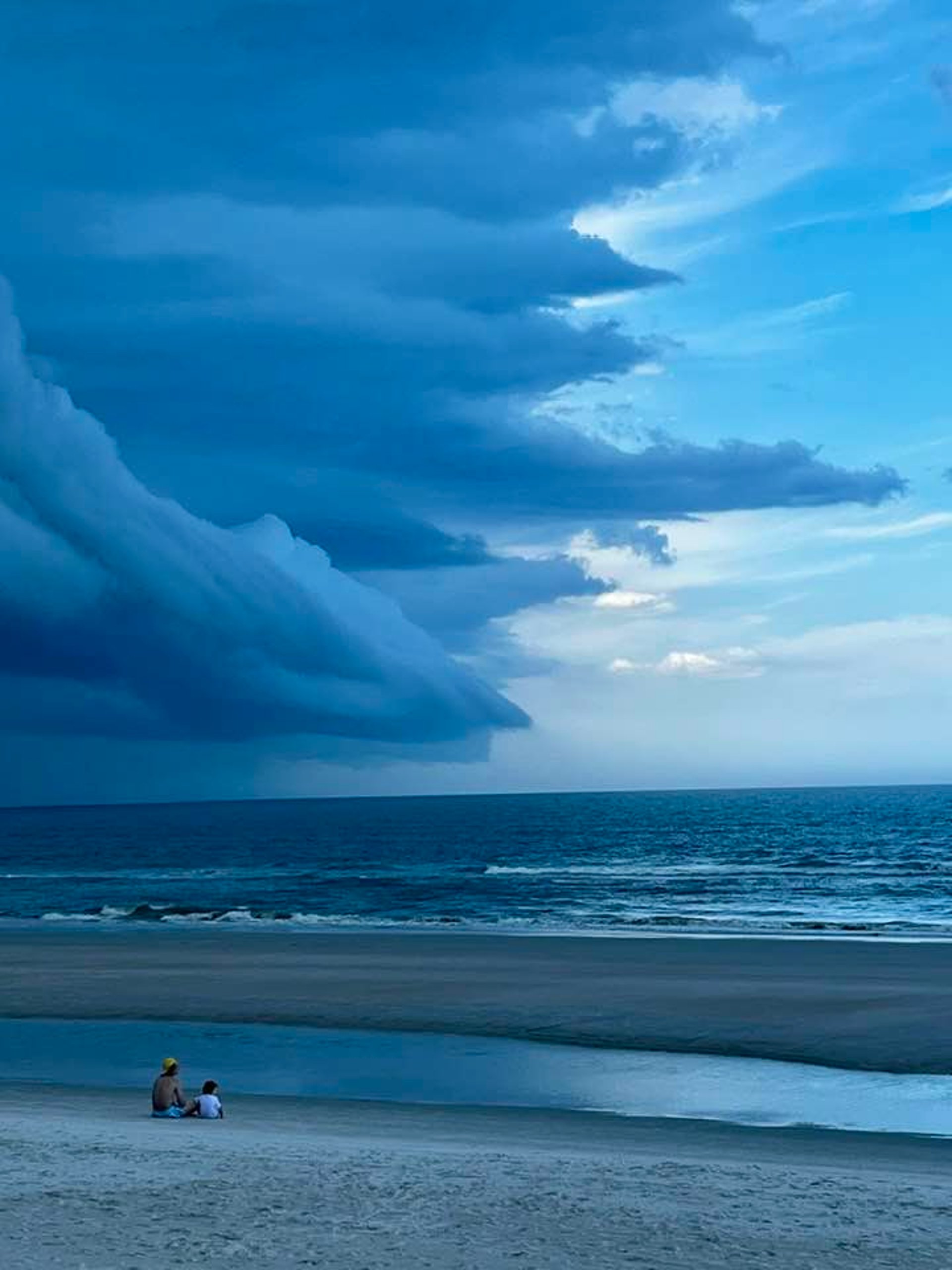 woman in black tank top and black leggings doing yoga