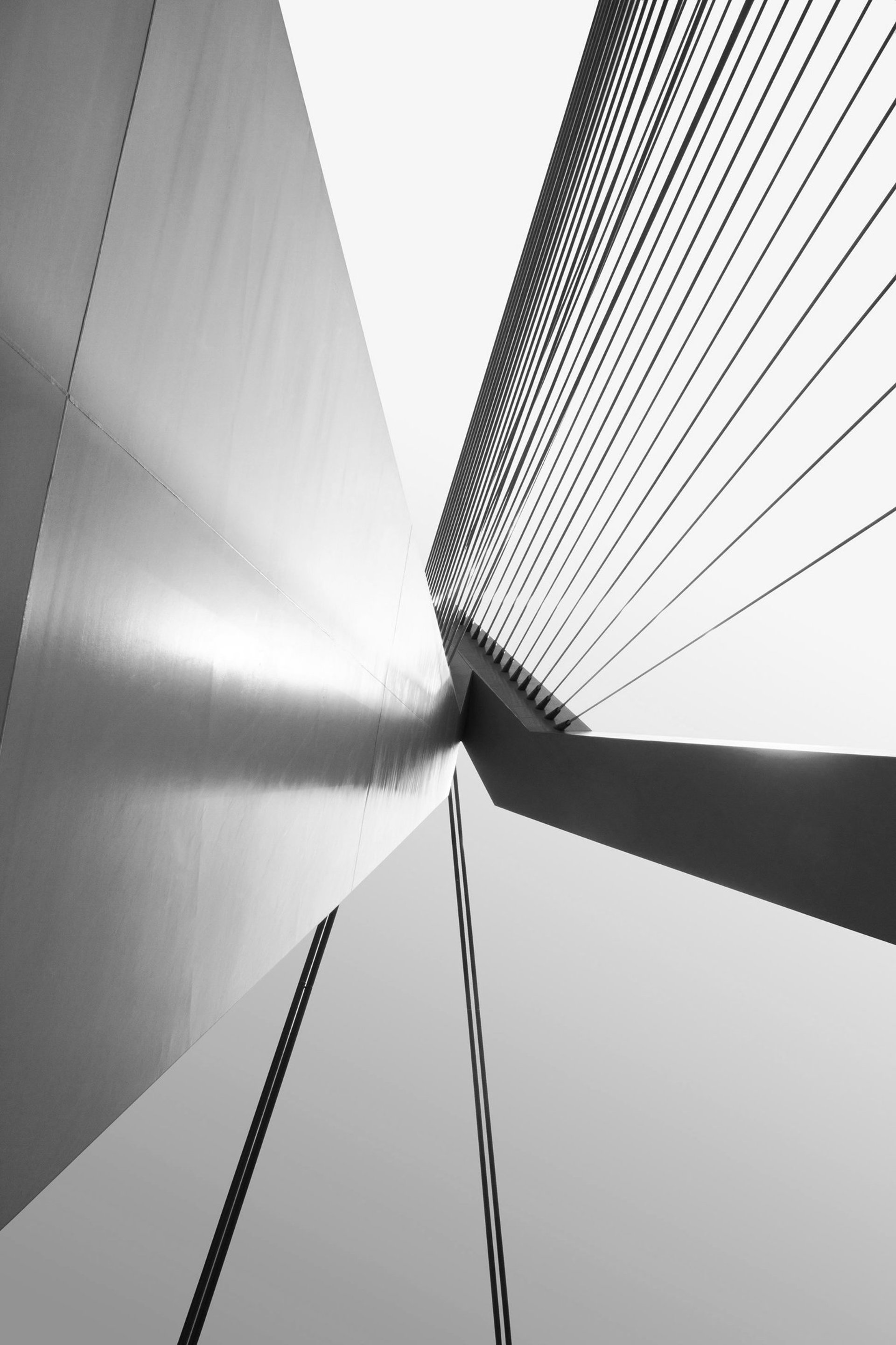 a bridge over a body of water with buildings in the background