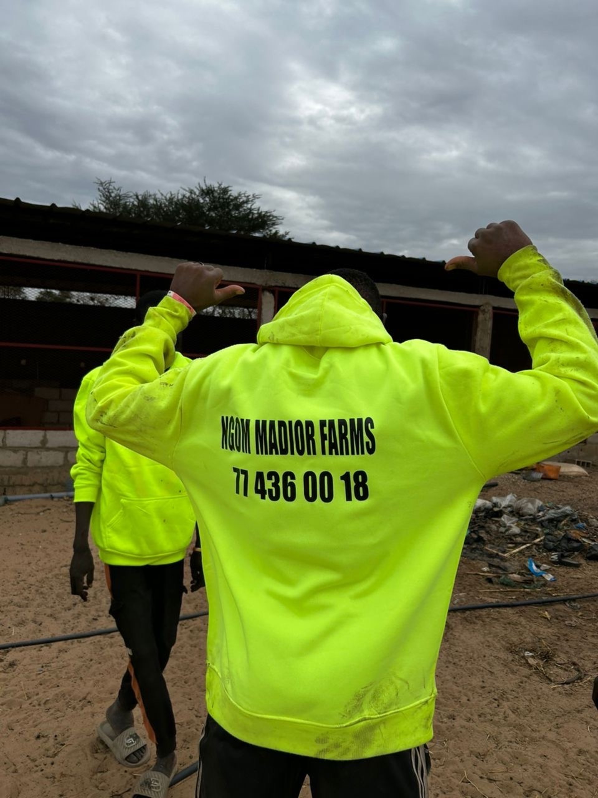 person wearing grey knit sweater