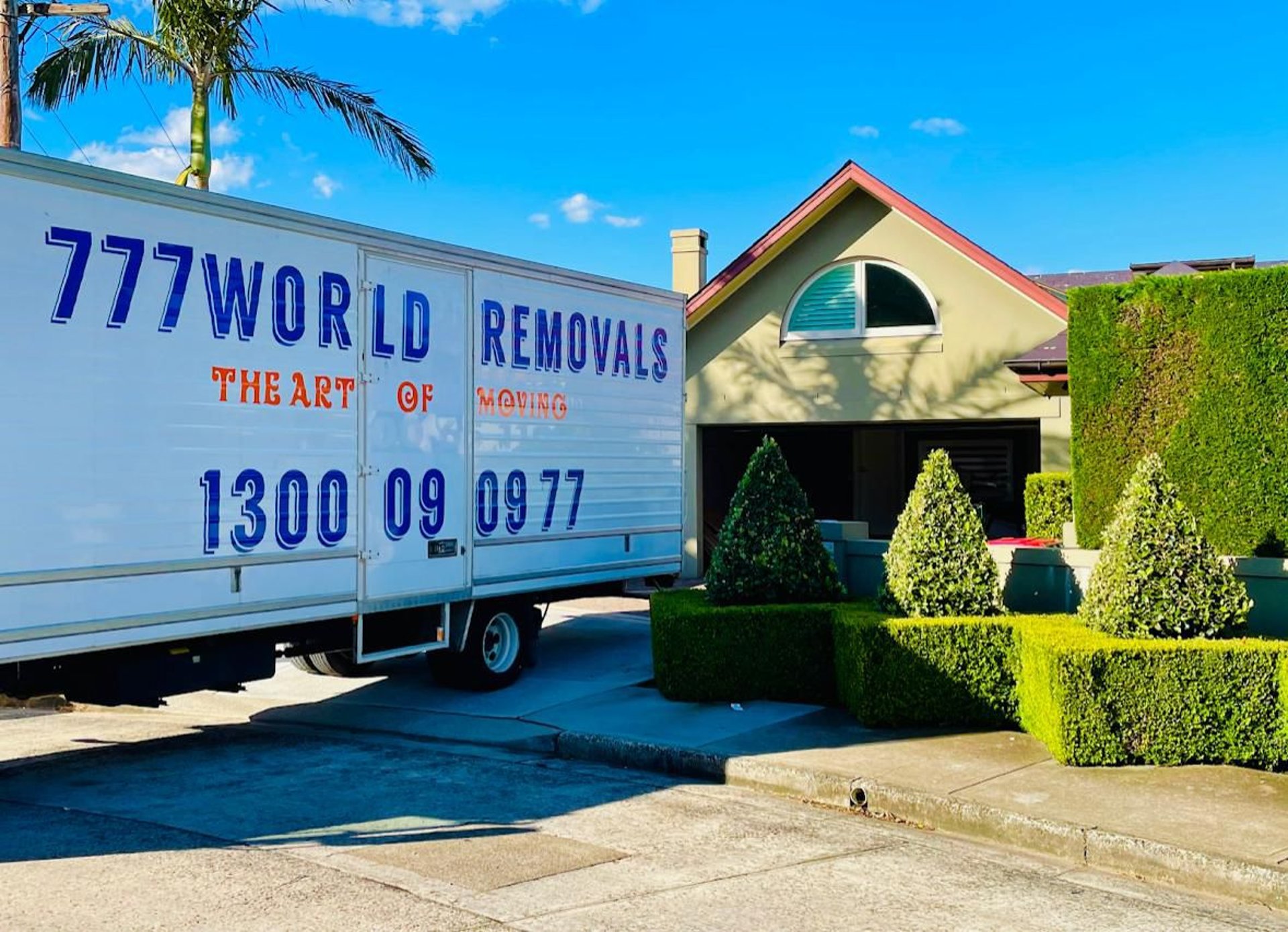 Couple looking at tablet surrounded by moving boxes