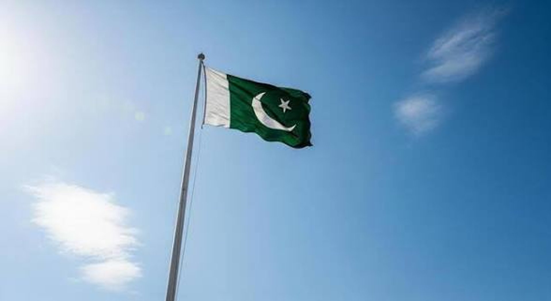 woman wearing yellow long-sleeved dress under white clouds and blue sky during daytime