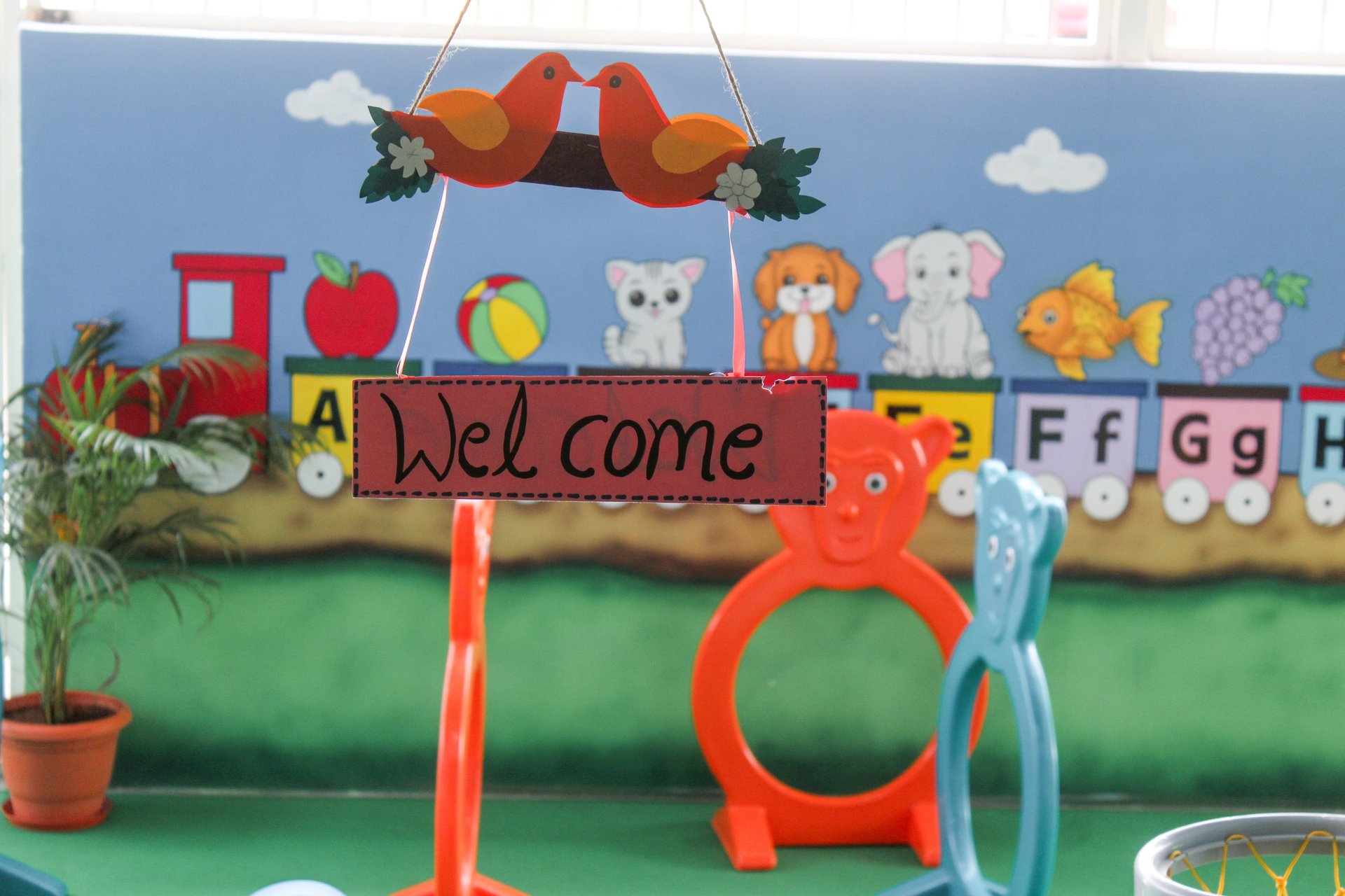 two young girls sitting at a table with markers and crayons