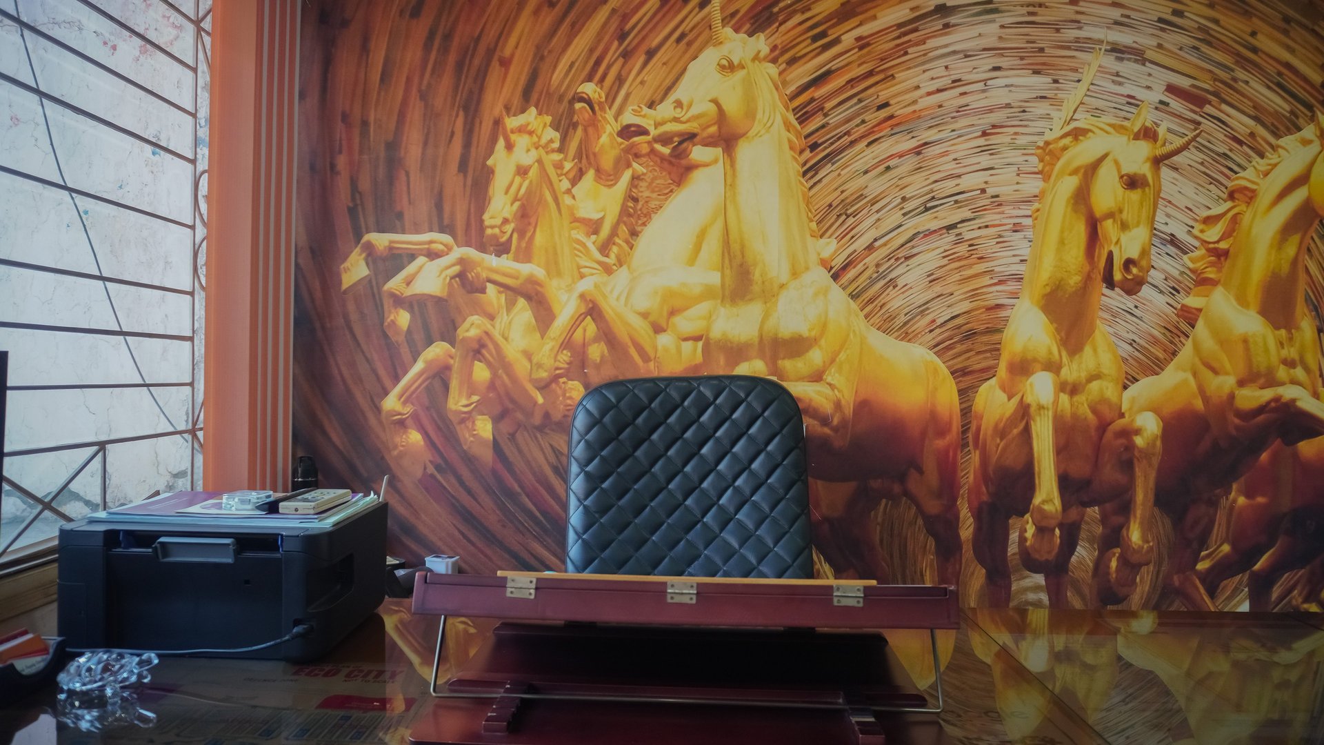 living room with brown sofa and glass window