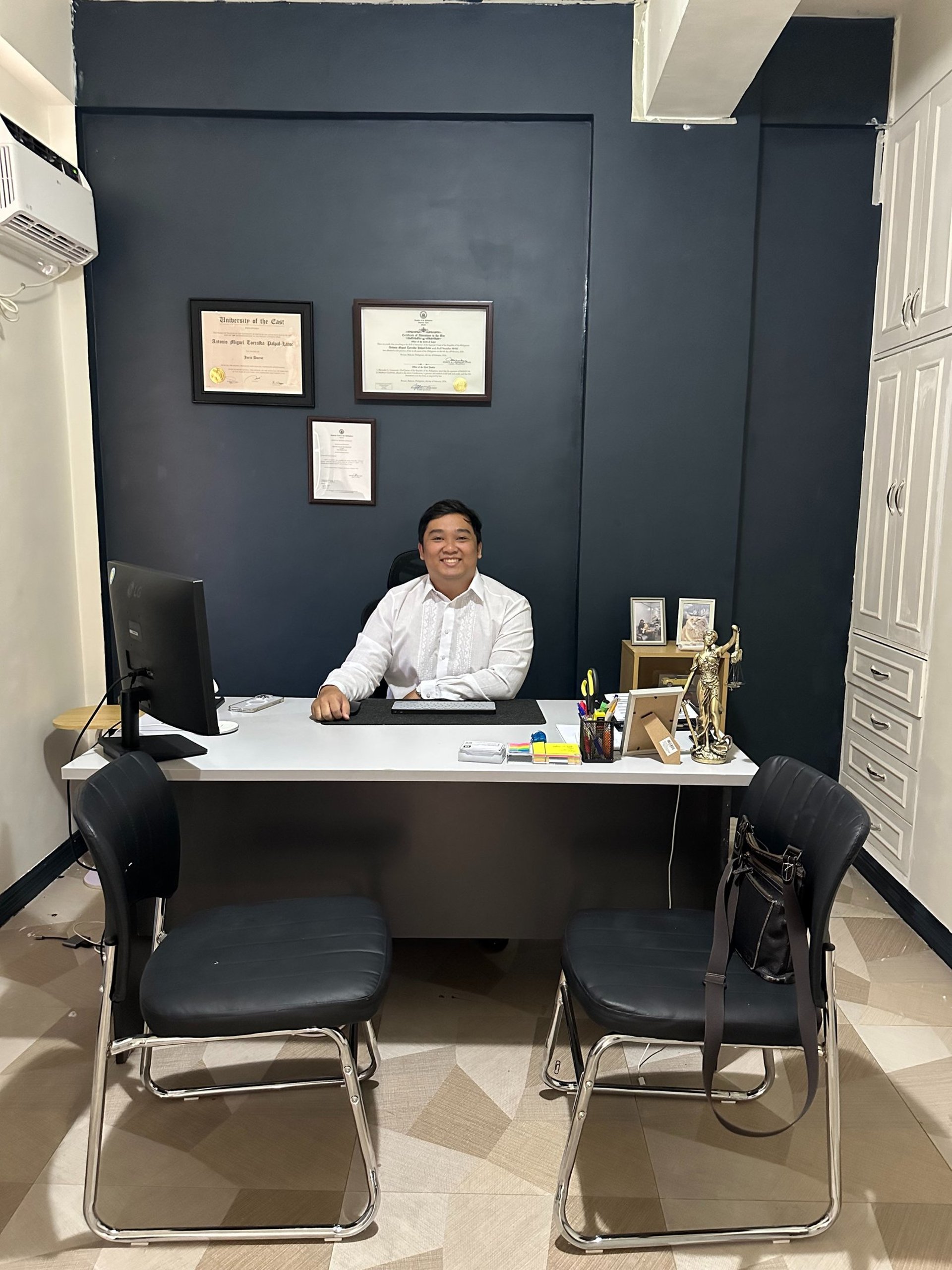 a pen sitting on top of a table next to a light