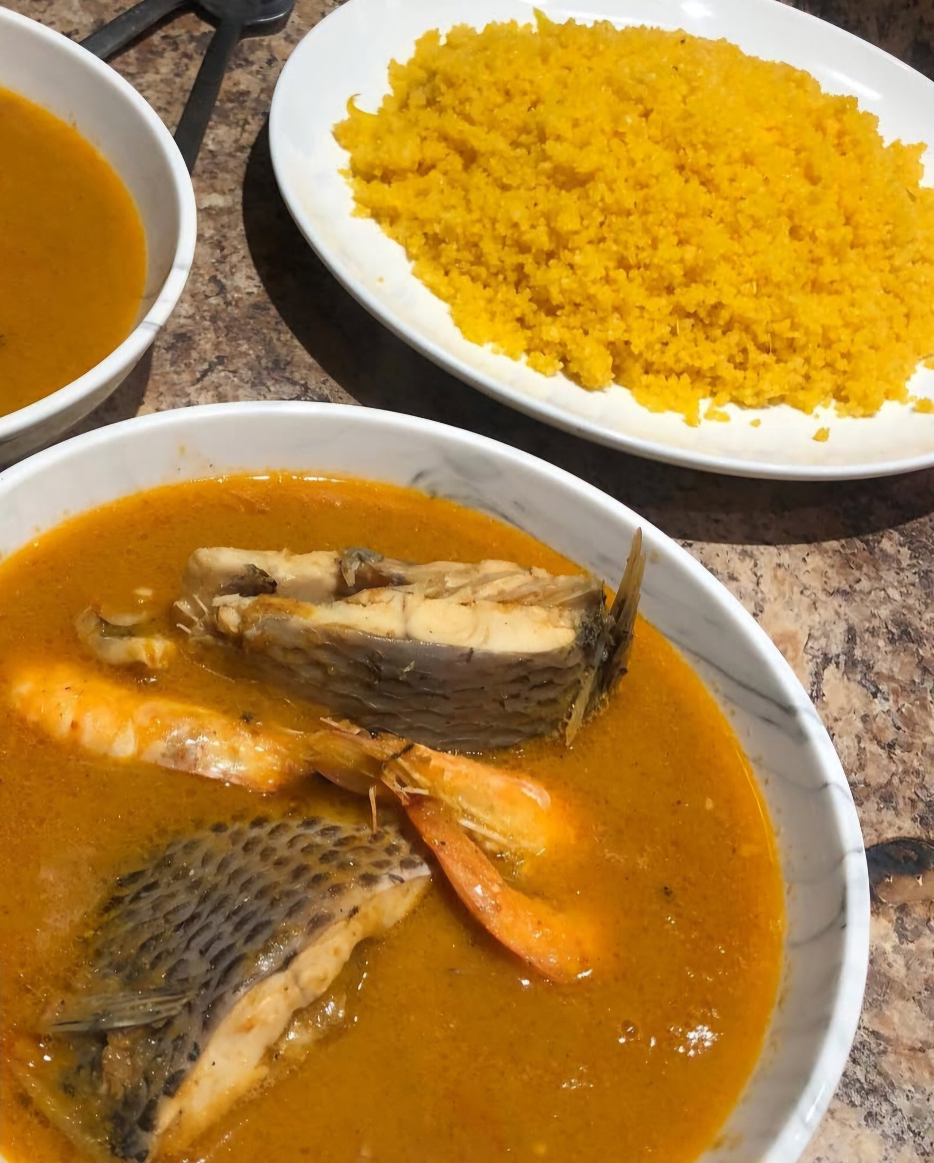 an abstract photo of a curved building with a blue sky in the background