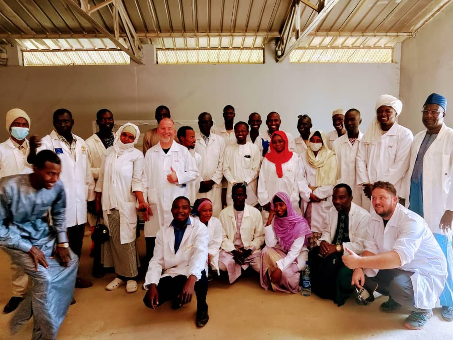 woman wearing yellow long-sleeved dress under white clouds and blue sky during daytime