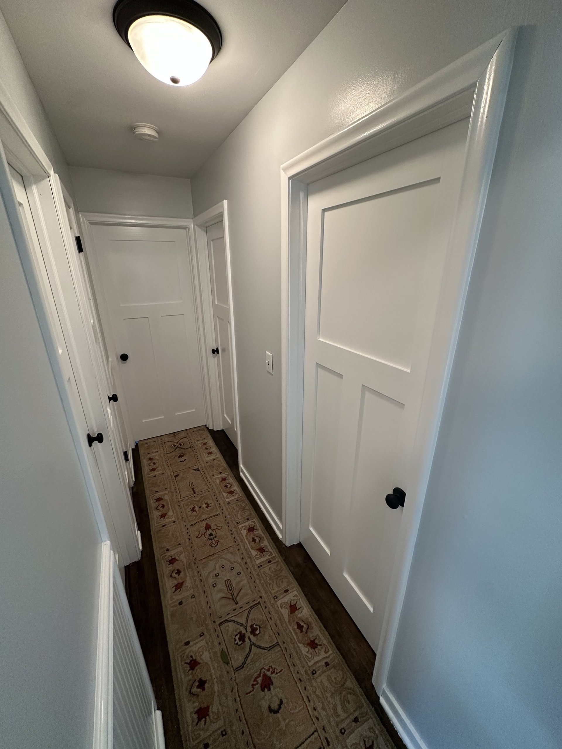 interior residential hallway with fresh white coat of paint