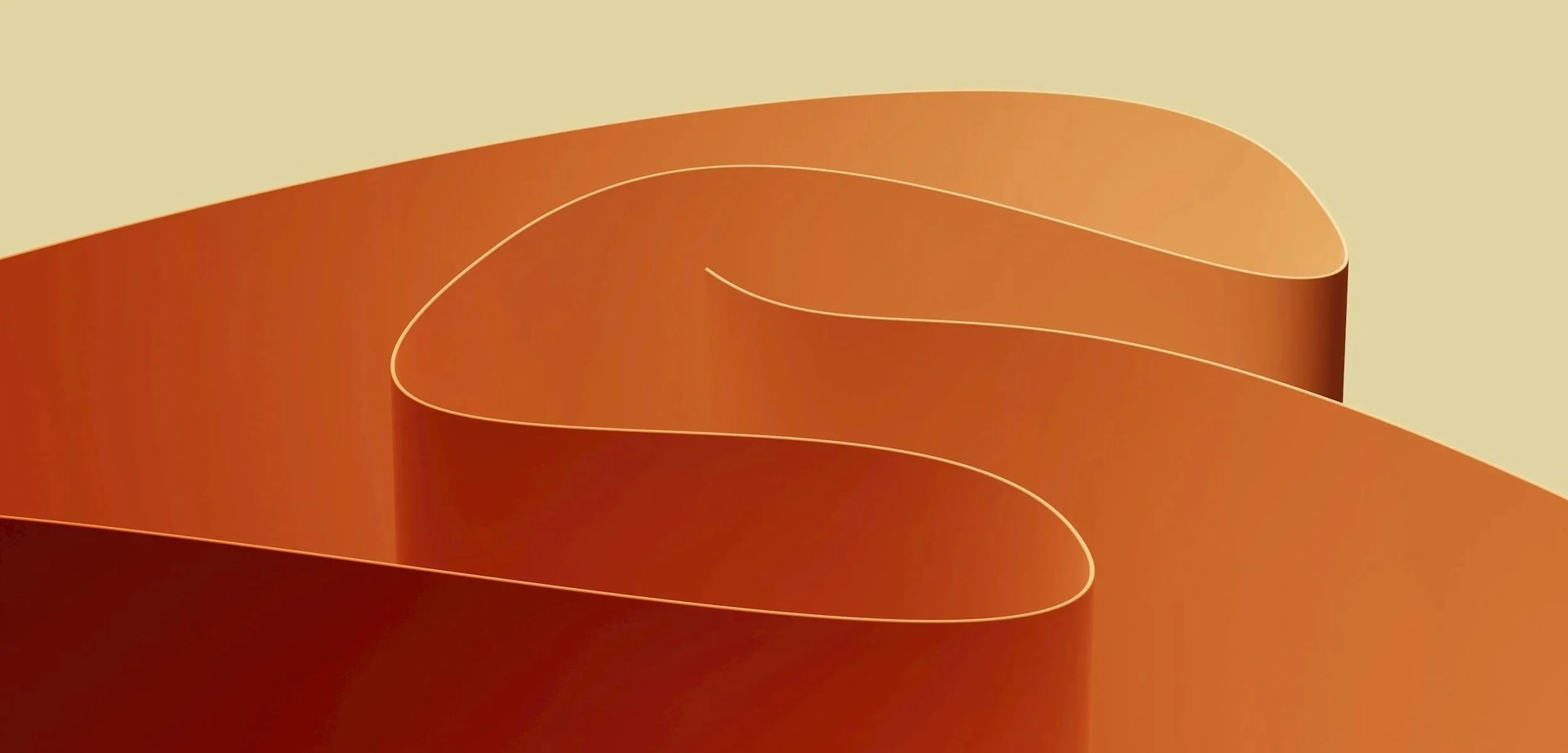 an abstract photo of a curved building with a blue sky in the background